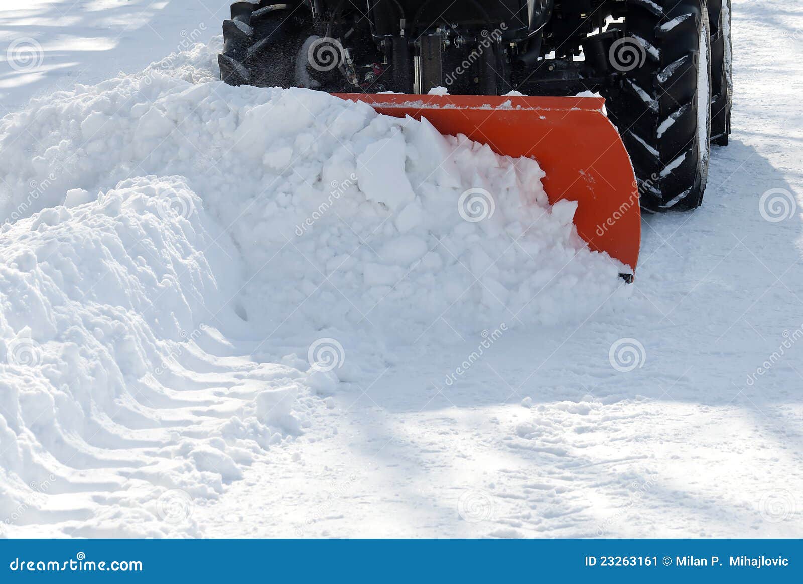 small tractor snow removal in the park