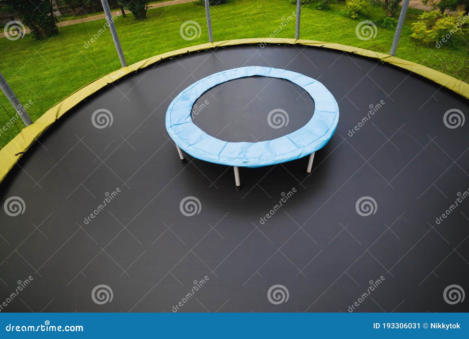 Small Trampoline On Big Round Mat, Size Comparison, Green Lawn