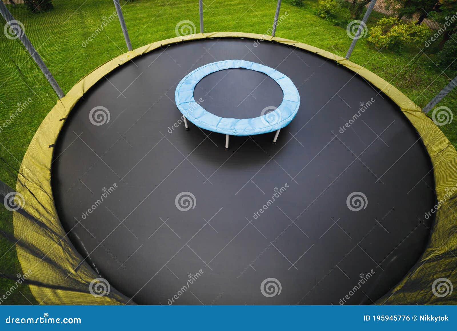 Small Trampoline On Big Round Mat, Size Comparison, Green Lawn