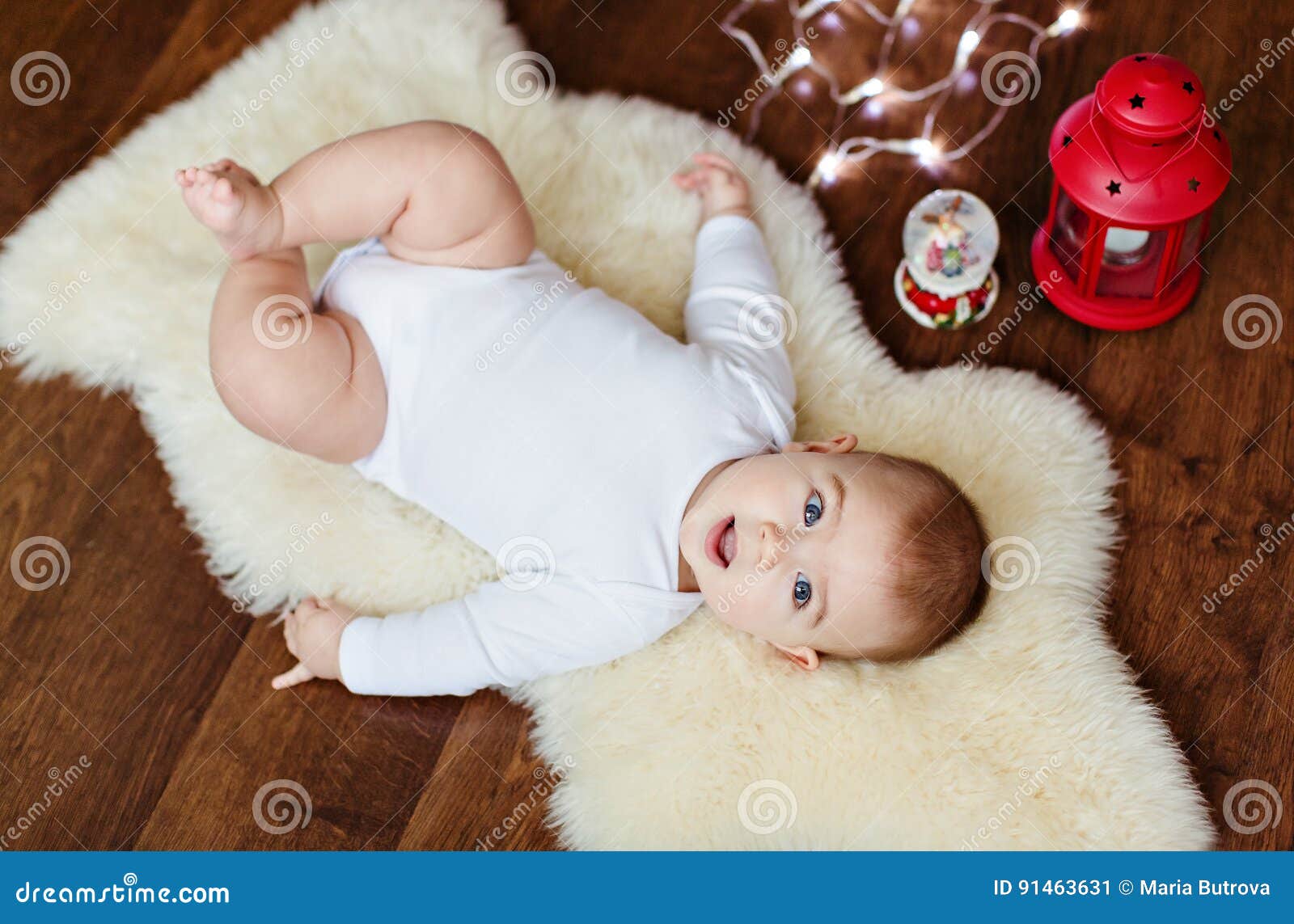 Small Very Cute Baby Lying on the White Skin of the Background L ...