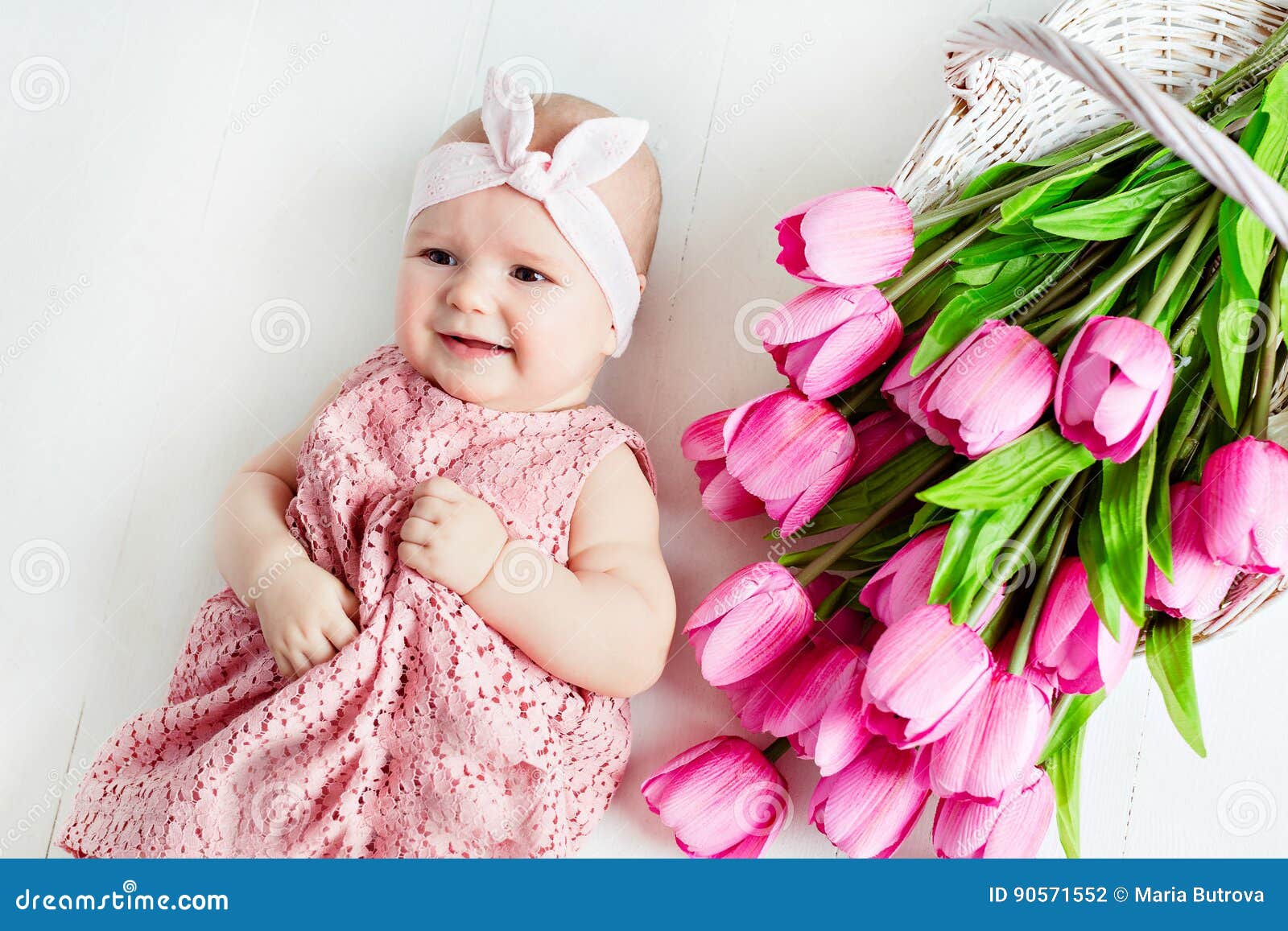 Small Very Cute, Big-eyed Little Baby Girl in a Pink Dress Lying ...