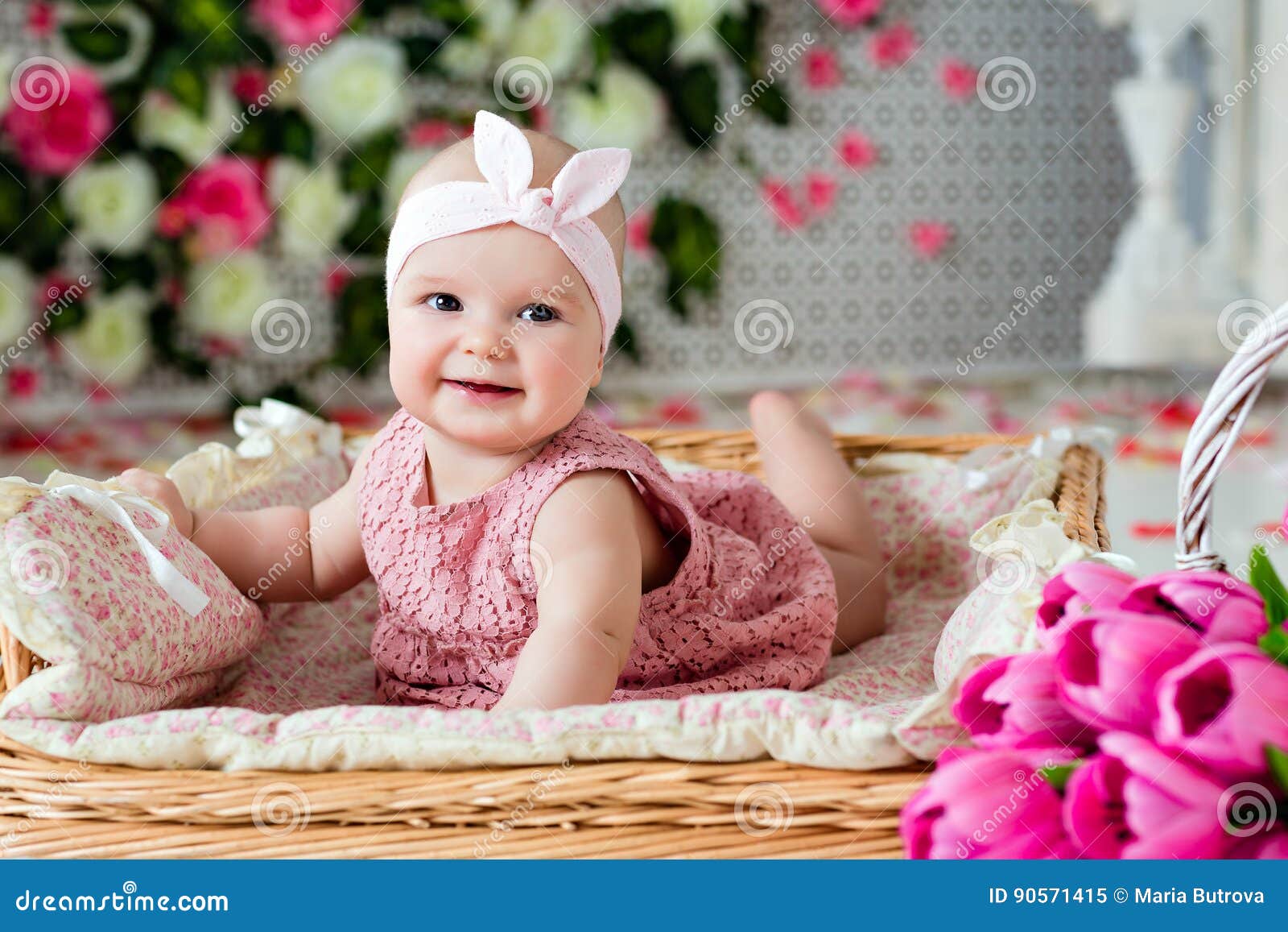 Small Very Cute Wide-eyed Smiling Baby Girl in a Pink Dress Lying ...