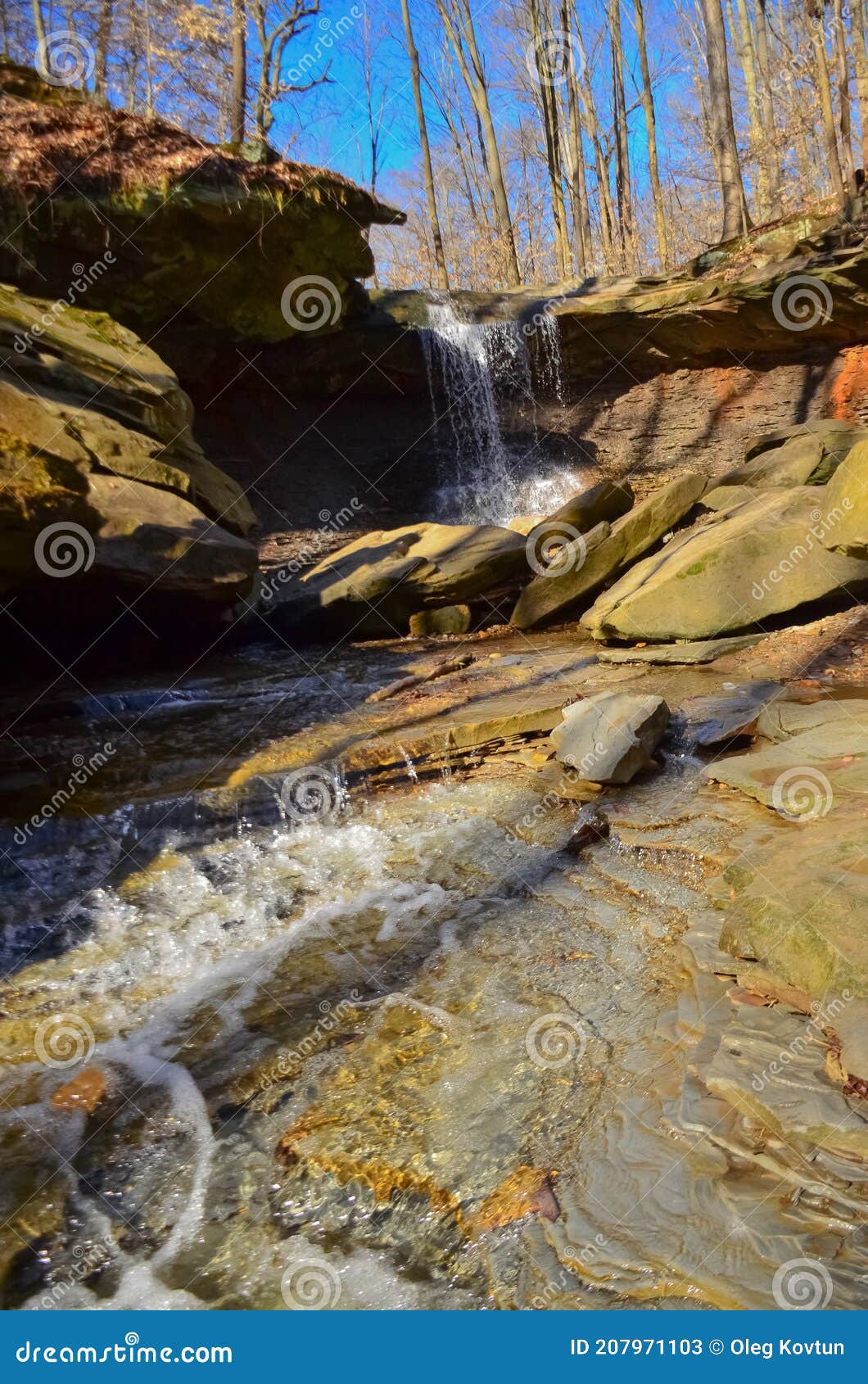 a small waterfall in the autumn in the forest in the parkon brandywine creek in cuyahoga valley national park, ohio