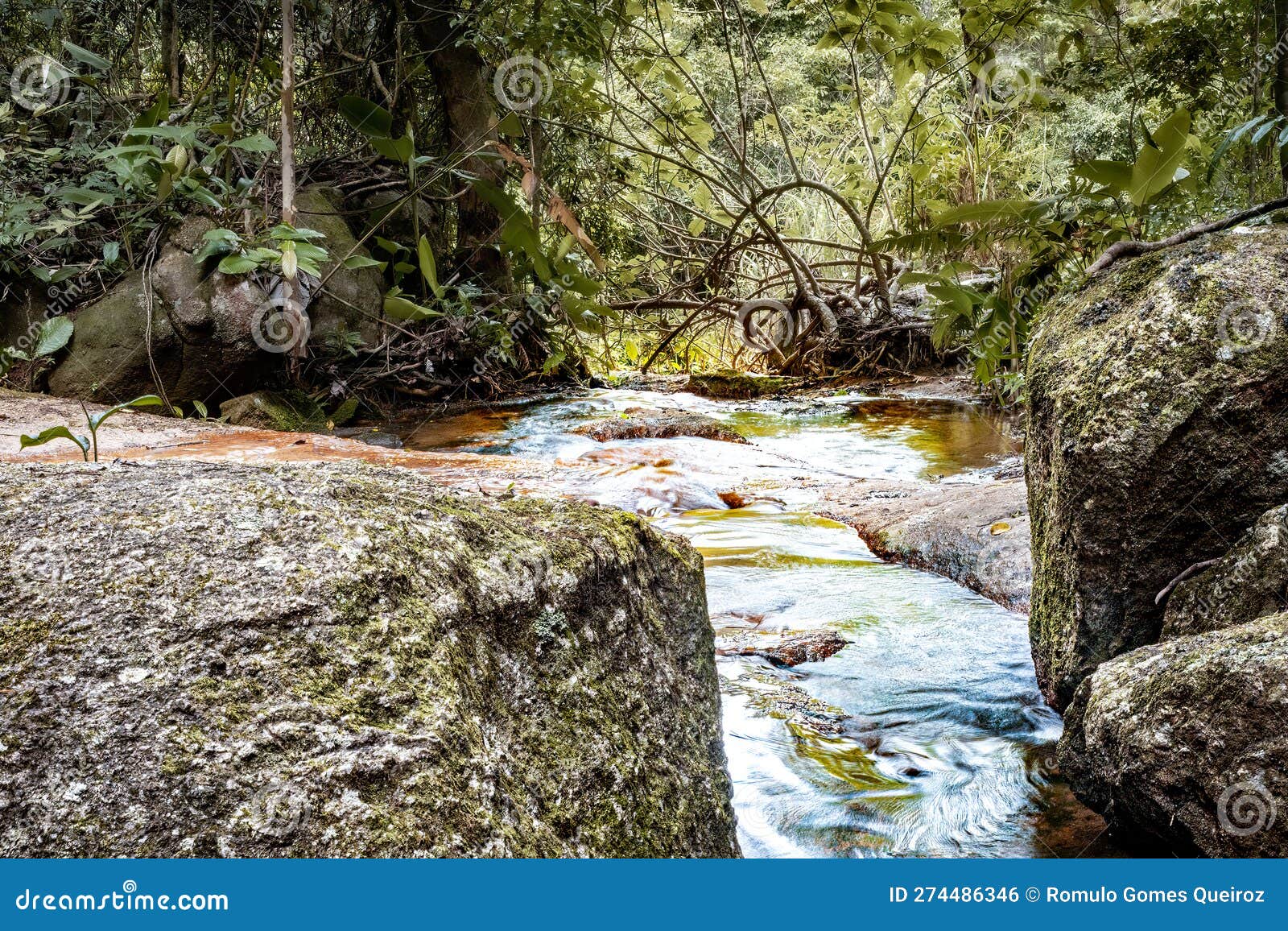 small waterfall on the mountain trail of 