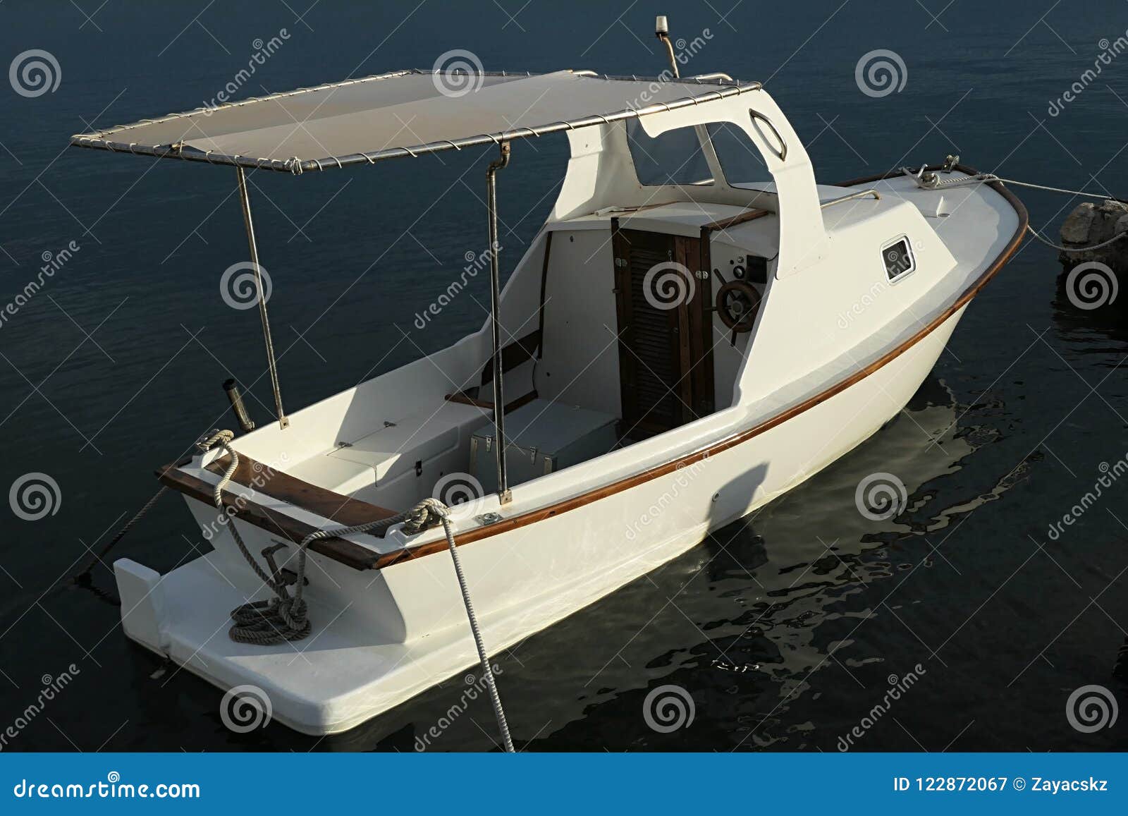 Small White Motor Fishing Boat with Wooden Helm, Simple Small