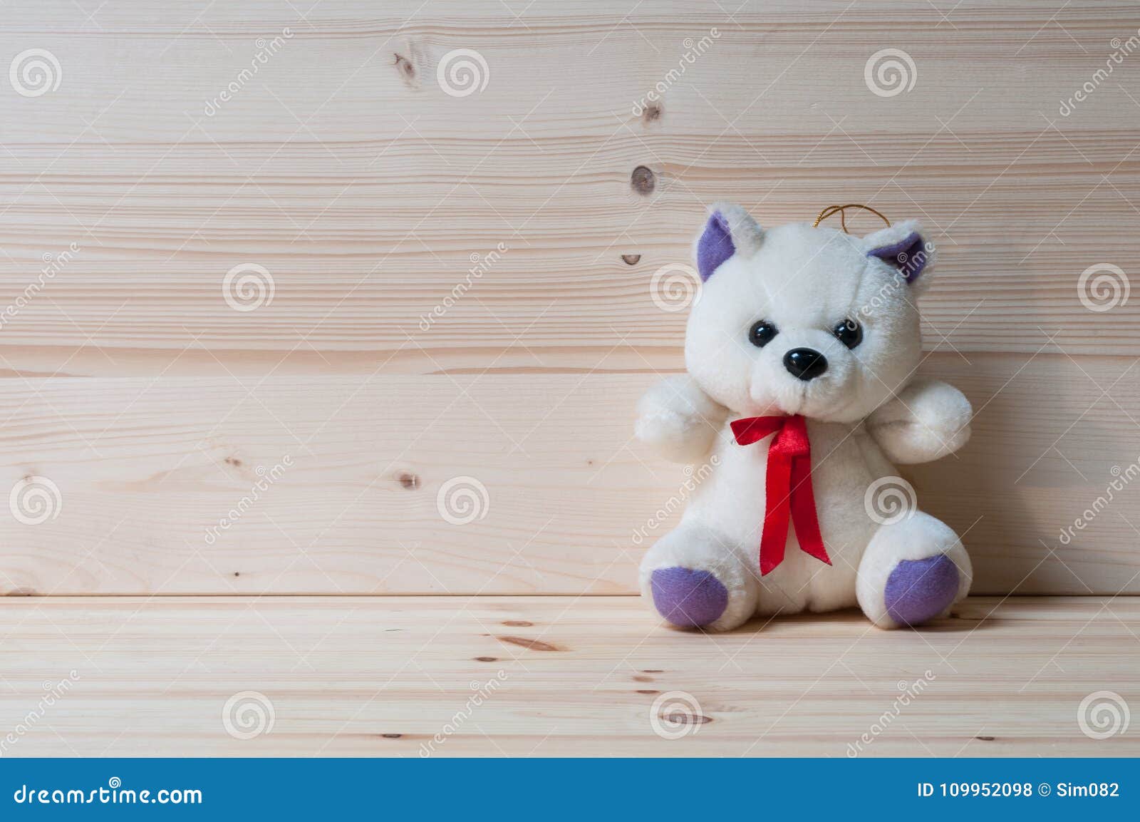 Small White Teddy Bear with Red Bow. Stock Photo Image of header