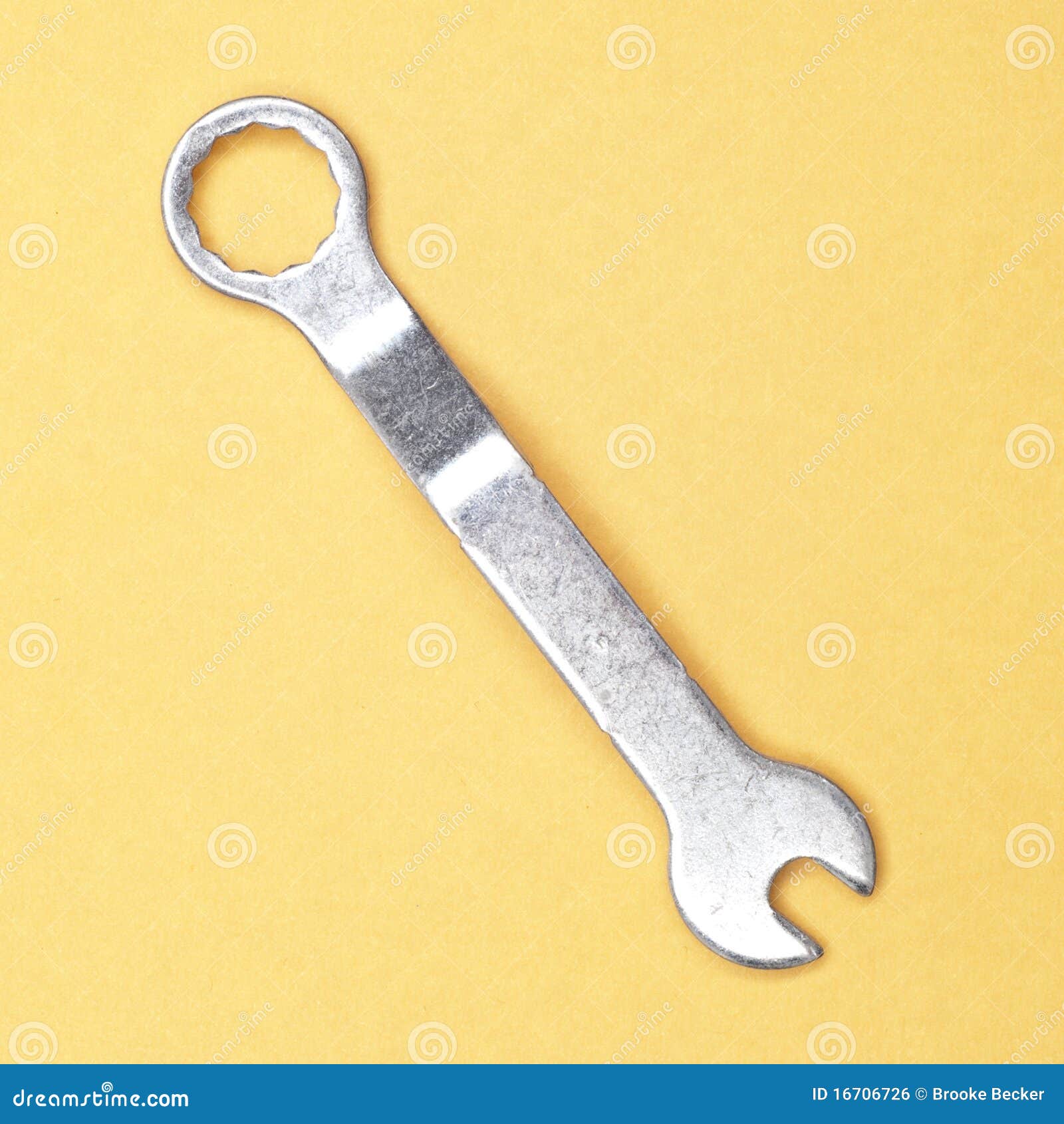 Small Wrench on Yellow. stock photo. Image of studio 16706726