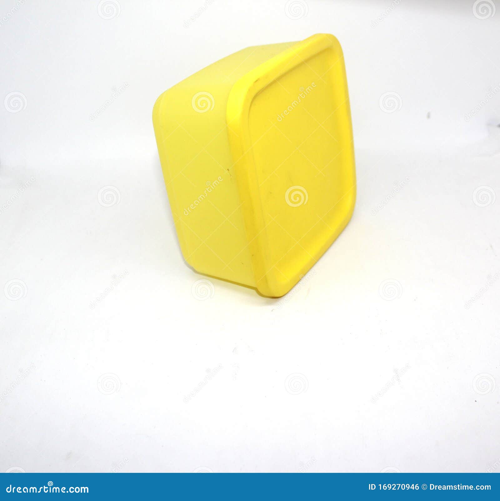 A Small Yellow Plastic Container Isolated on White Background Stock