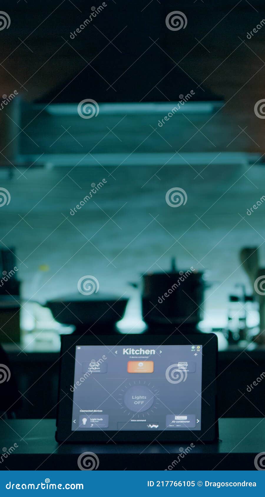 smart application on tablet placed on kitchen desk in empty house