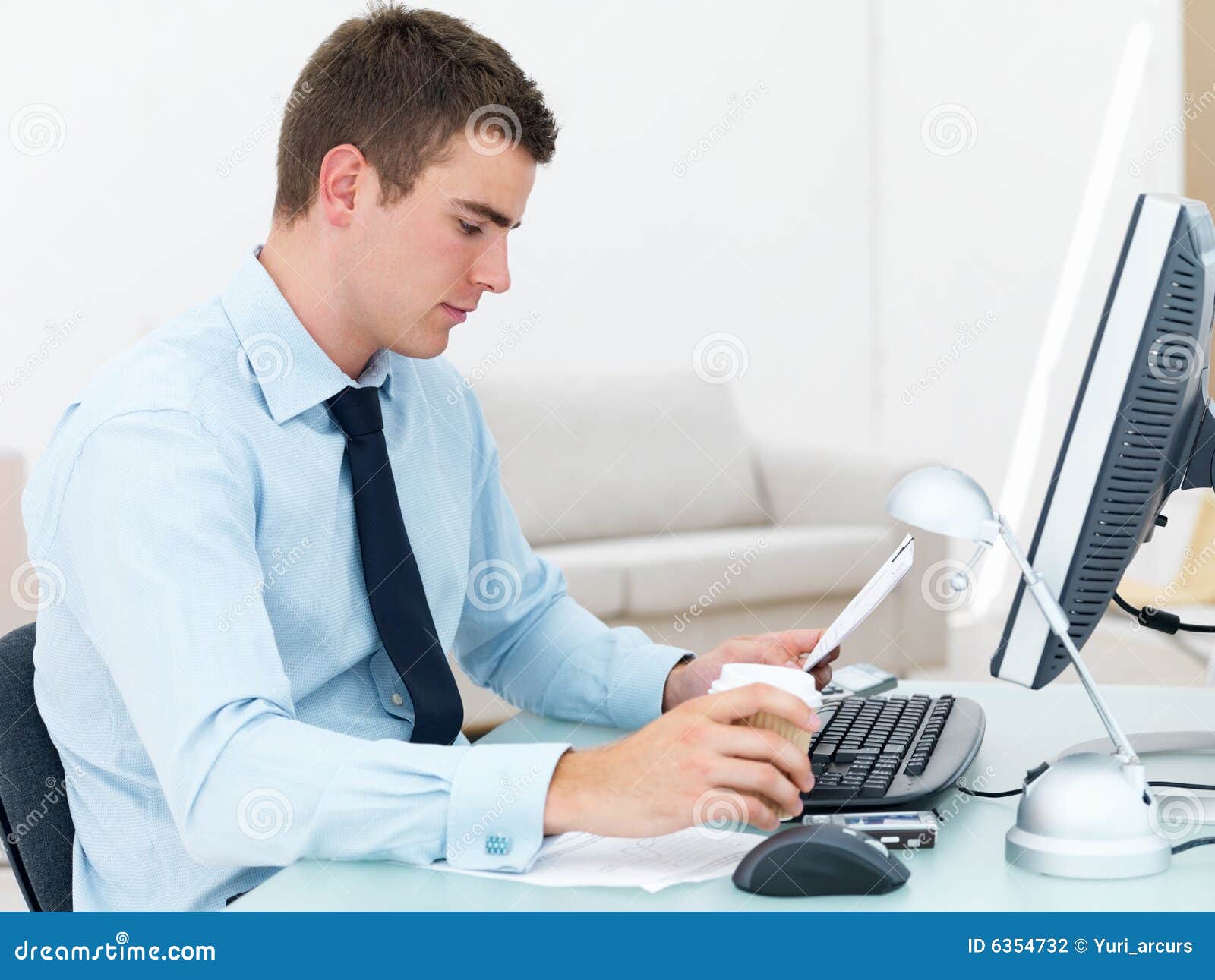 Smart Business Man At Office Desk Reading Paper Stock 