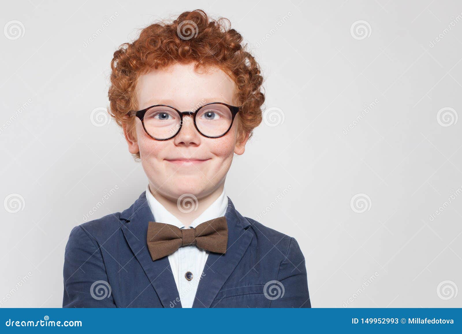 Smart Child Boy in Glasses Smiling on White Background. Clever Kid