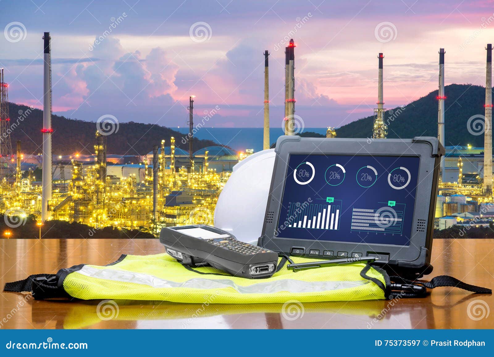 smart factory - rugged computers tablet in front of oil refinery