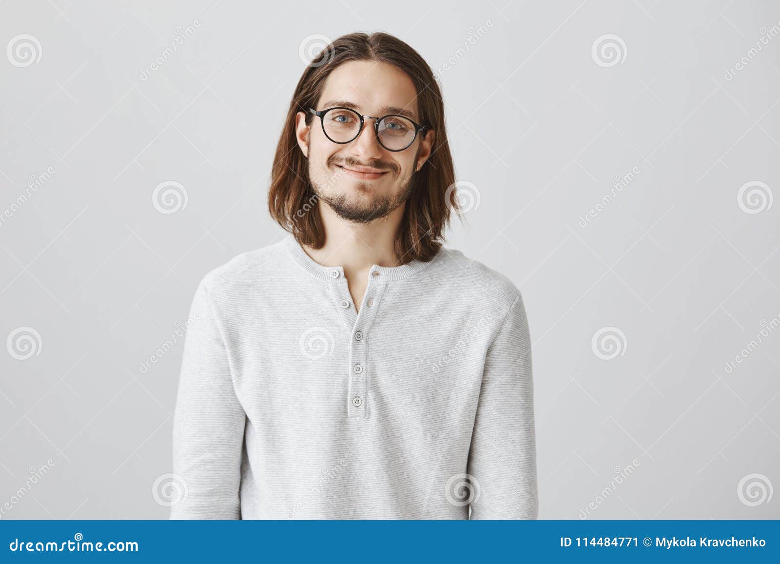 Handsome Young Man With Brown Long Hair Isolated On Grey Background Wearing Black Retro Glasses Fashion Studio Shot Expressive Face Stock Photo C Ysbrand 11591769
