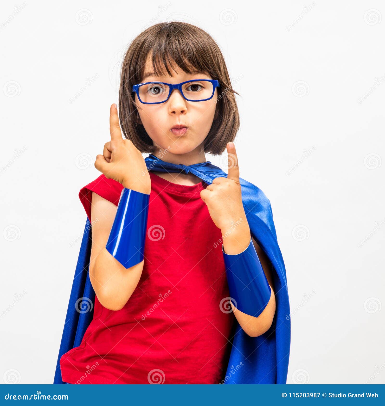 fun superhero child raising her gifted fingers for critical mindset