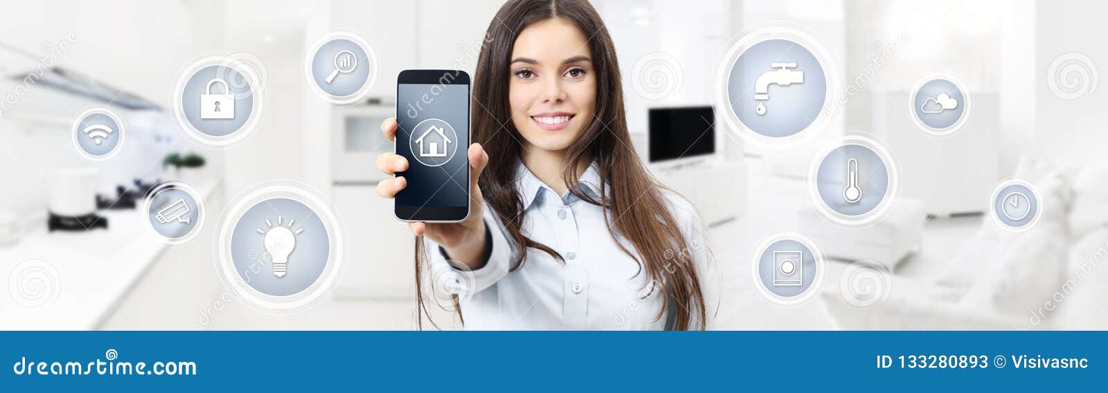 smart home control concept smiling woman showing cell phone screen with s on kitchen and living room blurred background