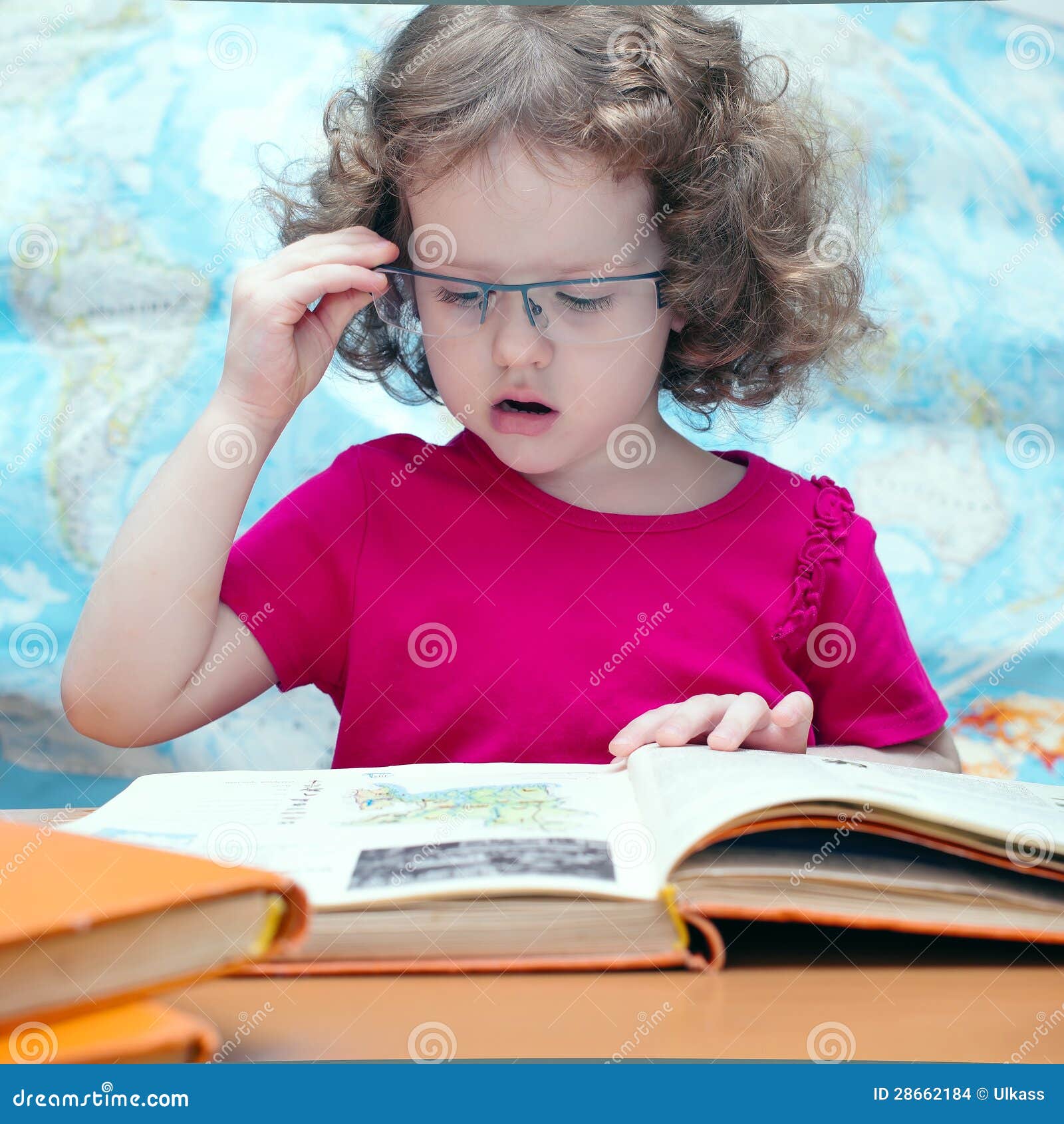 Smart Little Girl with Glasses Reading a Book Stock Photo Image of girl, childhood 28662184