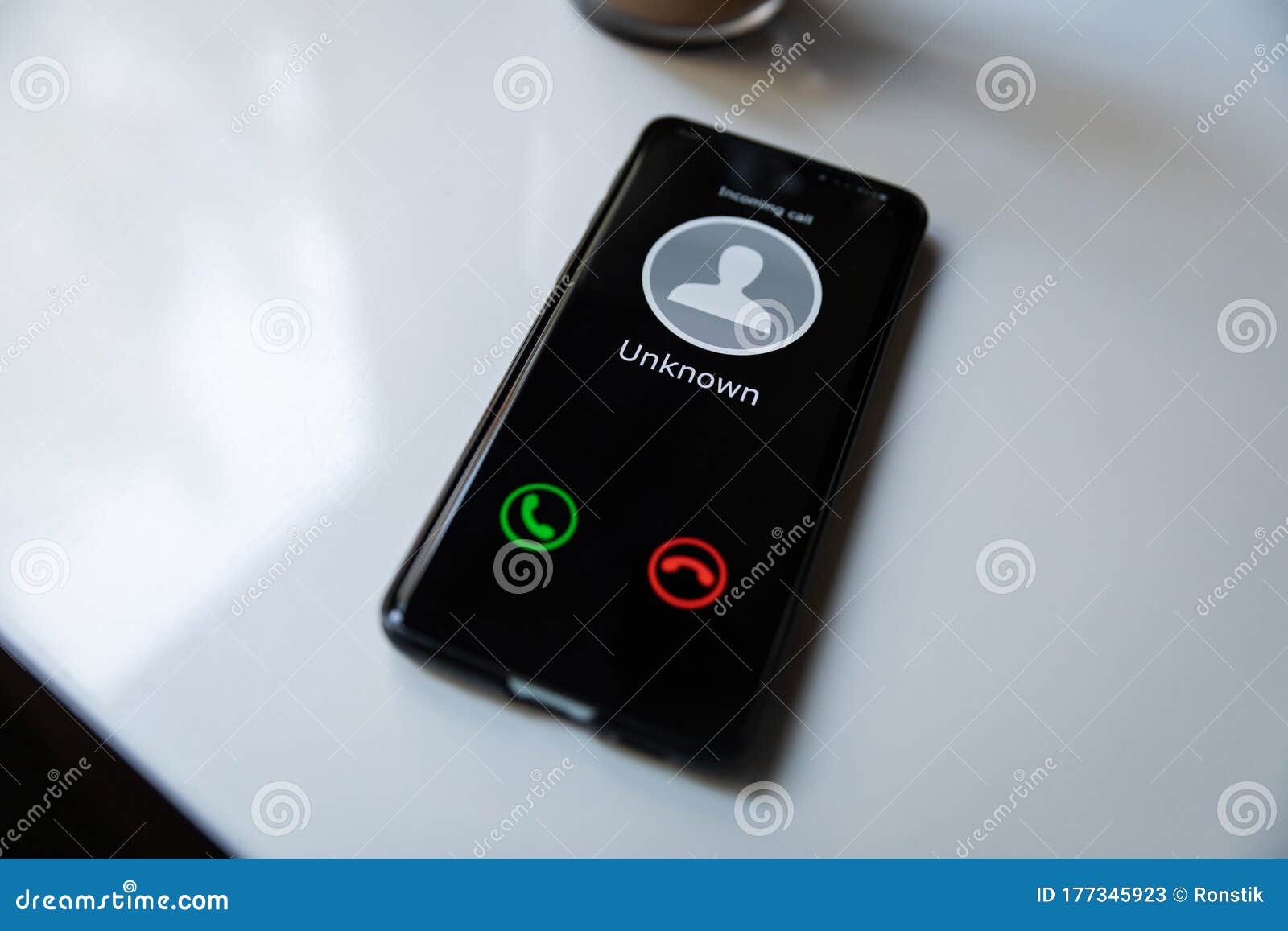 phone with incoming call from unknown caller. concept of scam spam and shadow calls