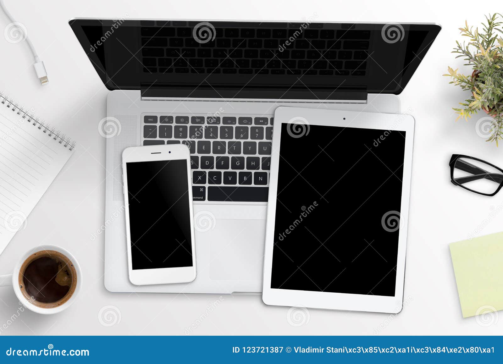 Smart Phone And Tablet Mockup On Laptop Keyboard Office Desk