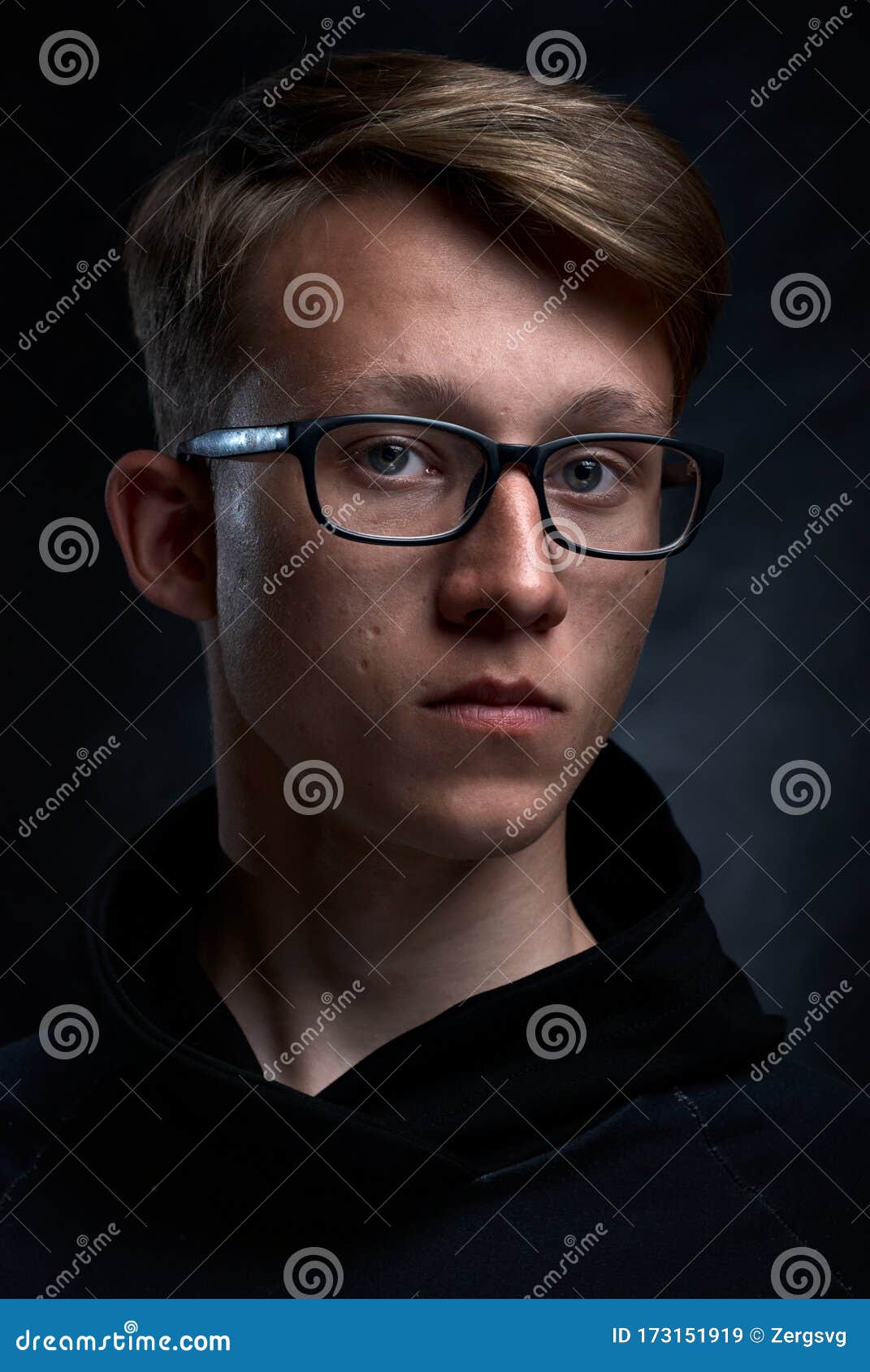 Smart Teenager with Short Hair and Glasses an Black Background. Strong and  Handsome Face Stock Image - Image of hood, hair: 173151919