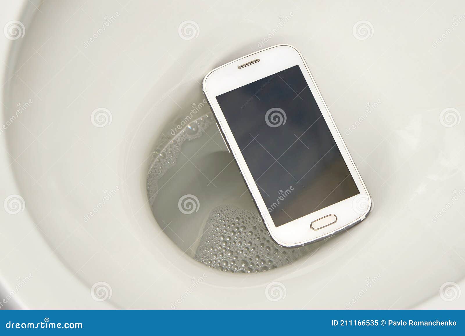 A Smartphone Accidentally Fell into the Toilet Stock Image - Image of