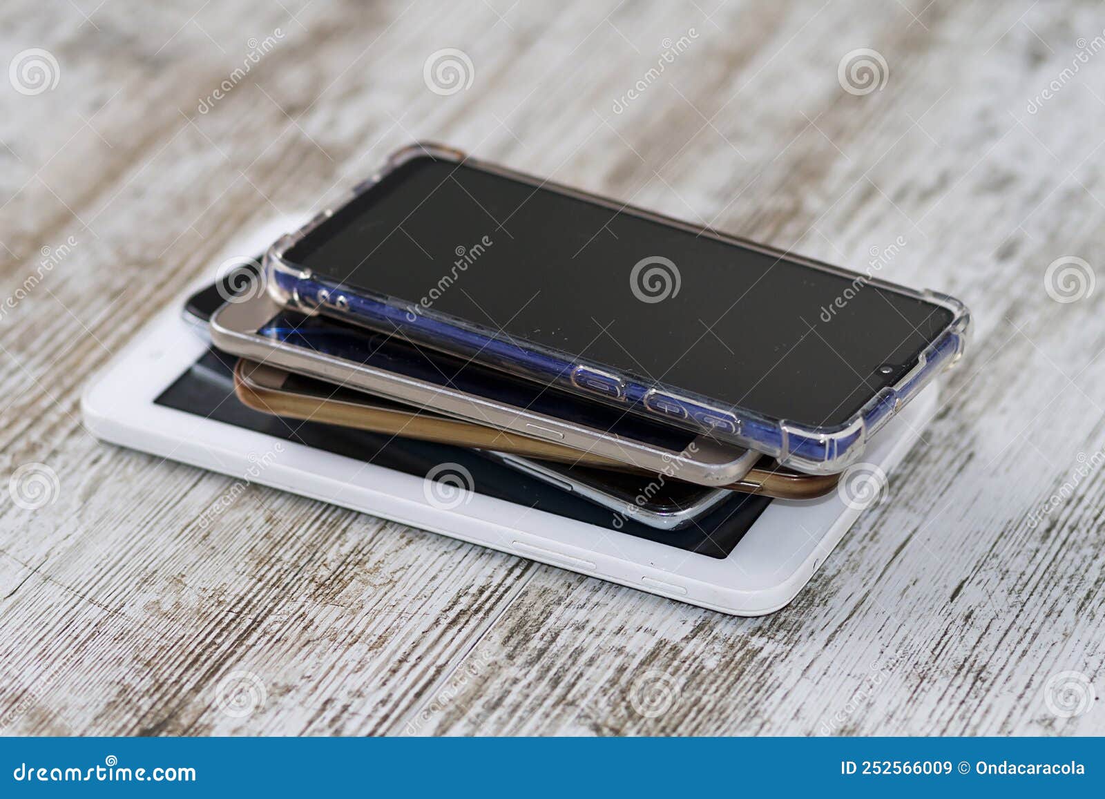 Smartphones pile and cable stock image. Image of lifestyle 252566009