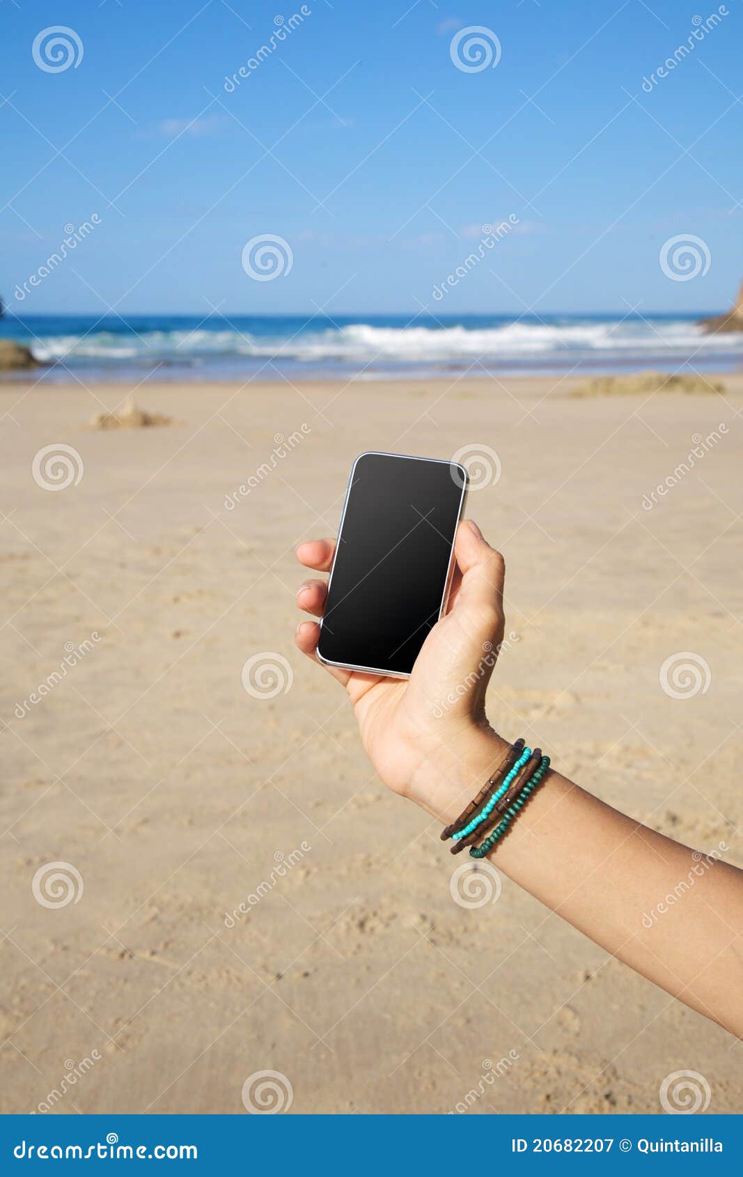Smartphone in the beach stock image. Image of electronic 20682207