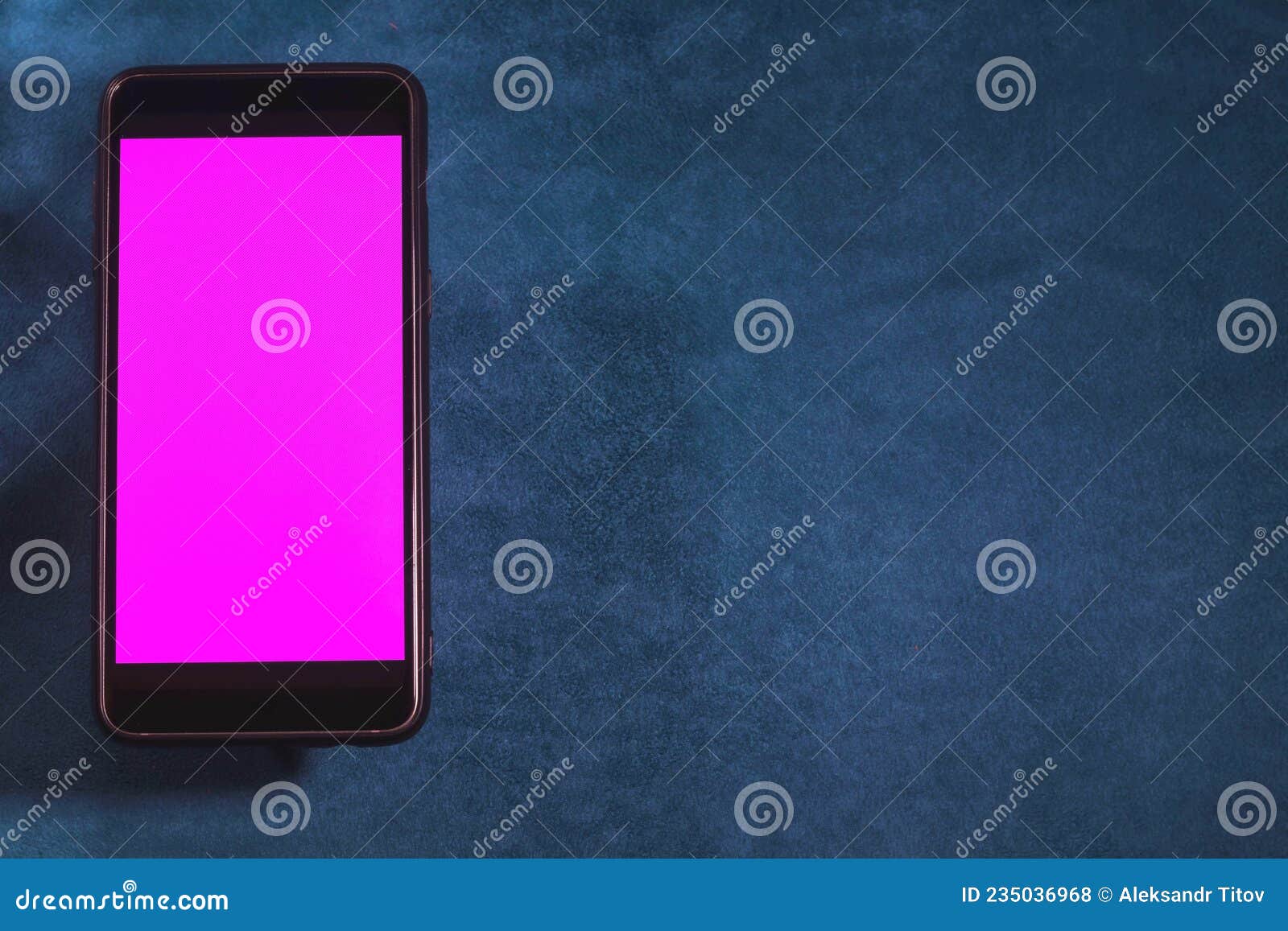 Smartphone with Blank Purple Screen on Blue Velvet Background. Stock