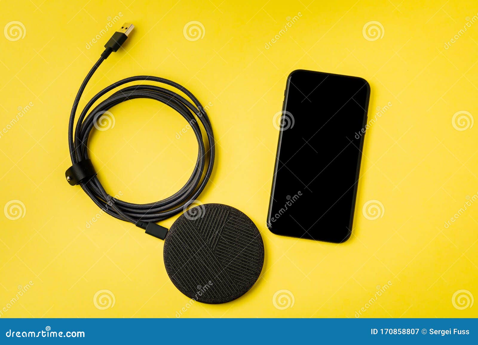 The Smartphone is Charged by a Wireless Charger Concept of New