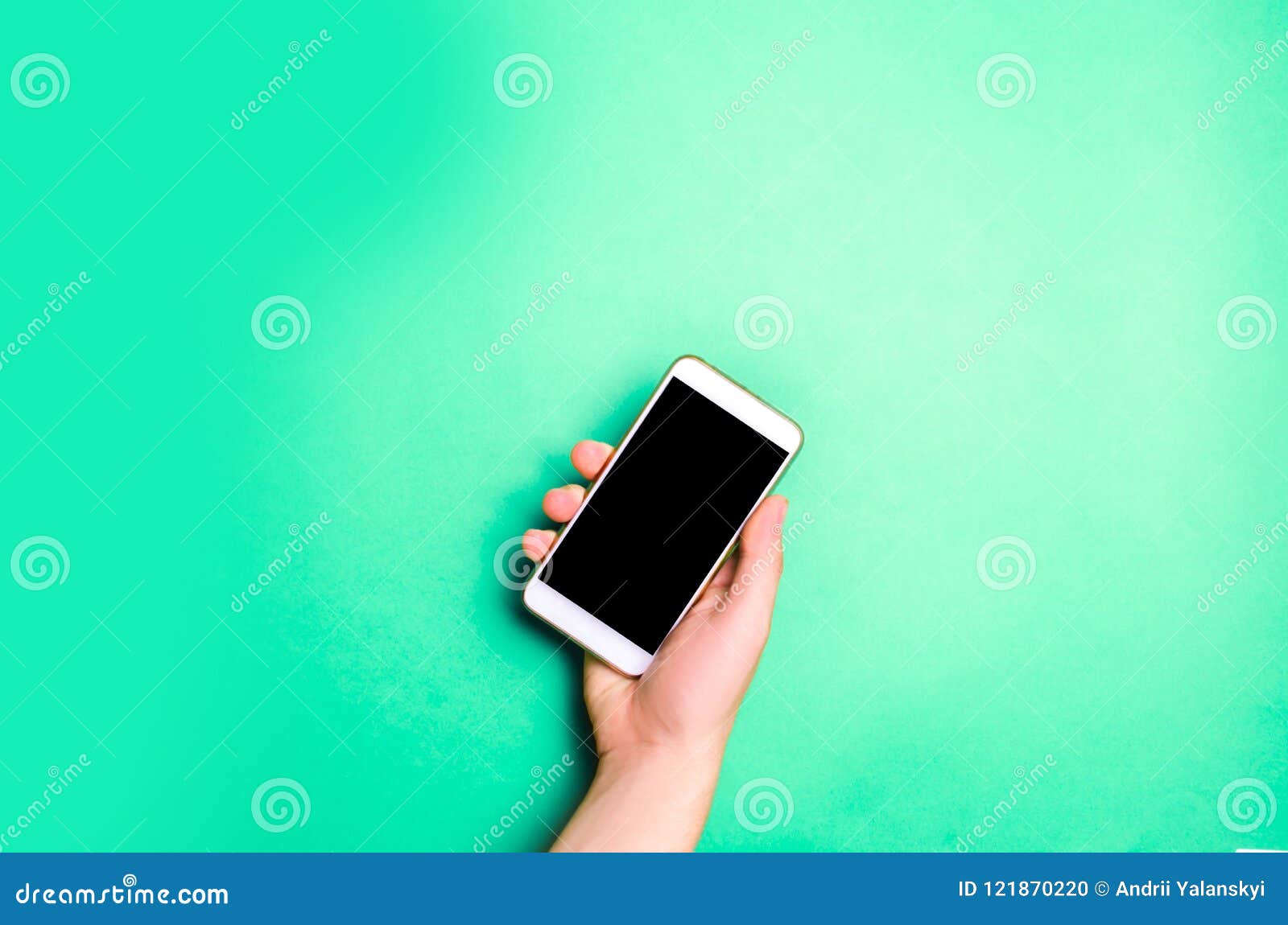 smartphone, phone in male hands on a green background. the concept of communication. use of gadgets, modern technologies. social n