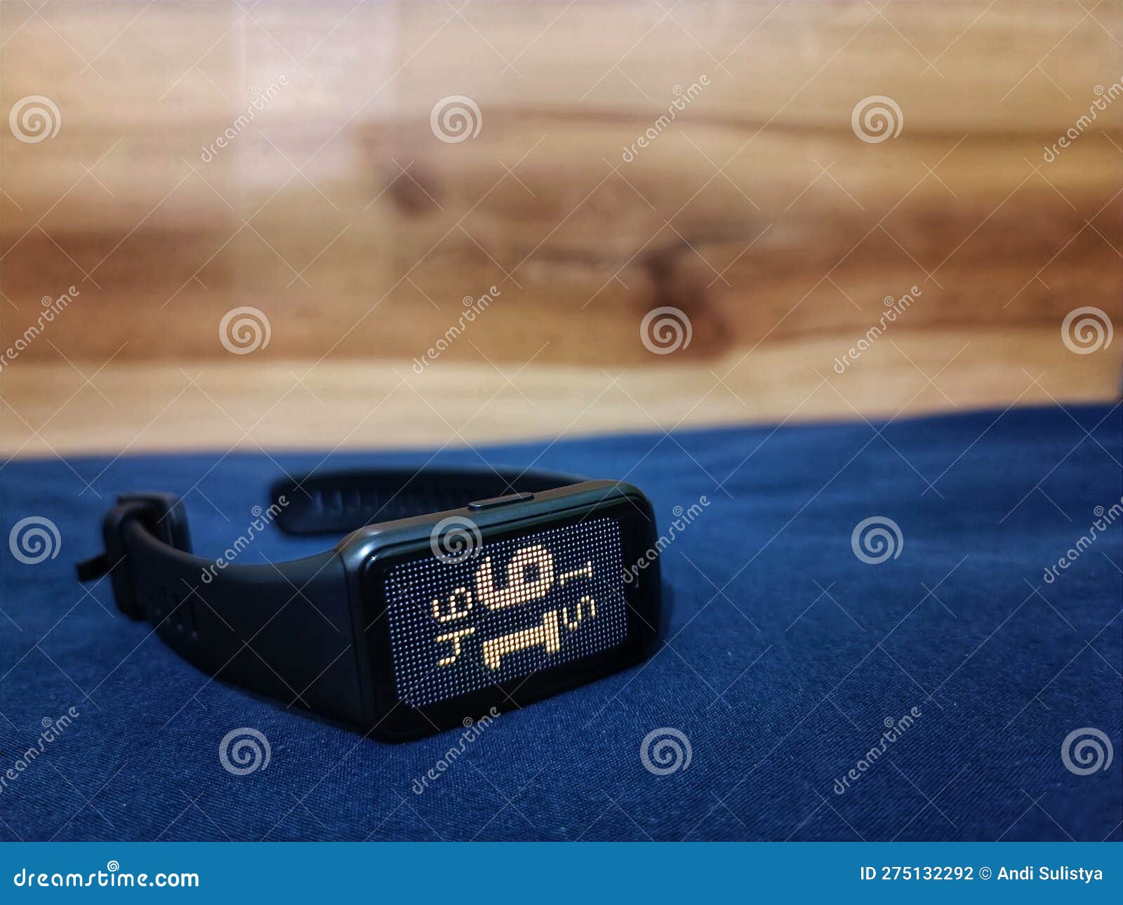 Smartwatch on the bed stock photo. Image of black, gold 275132292