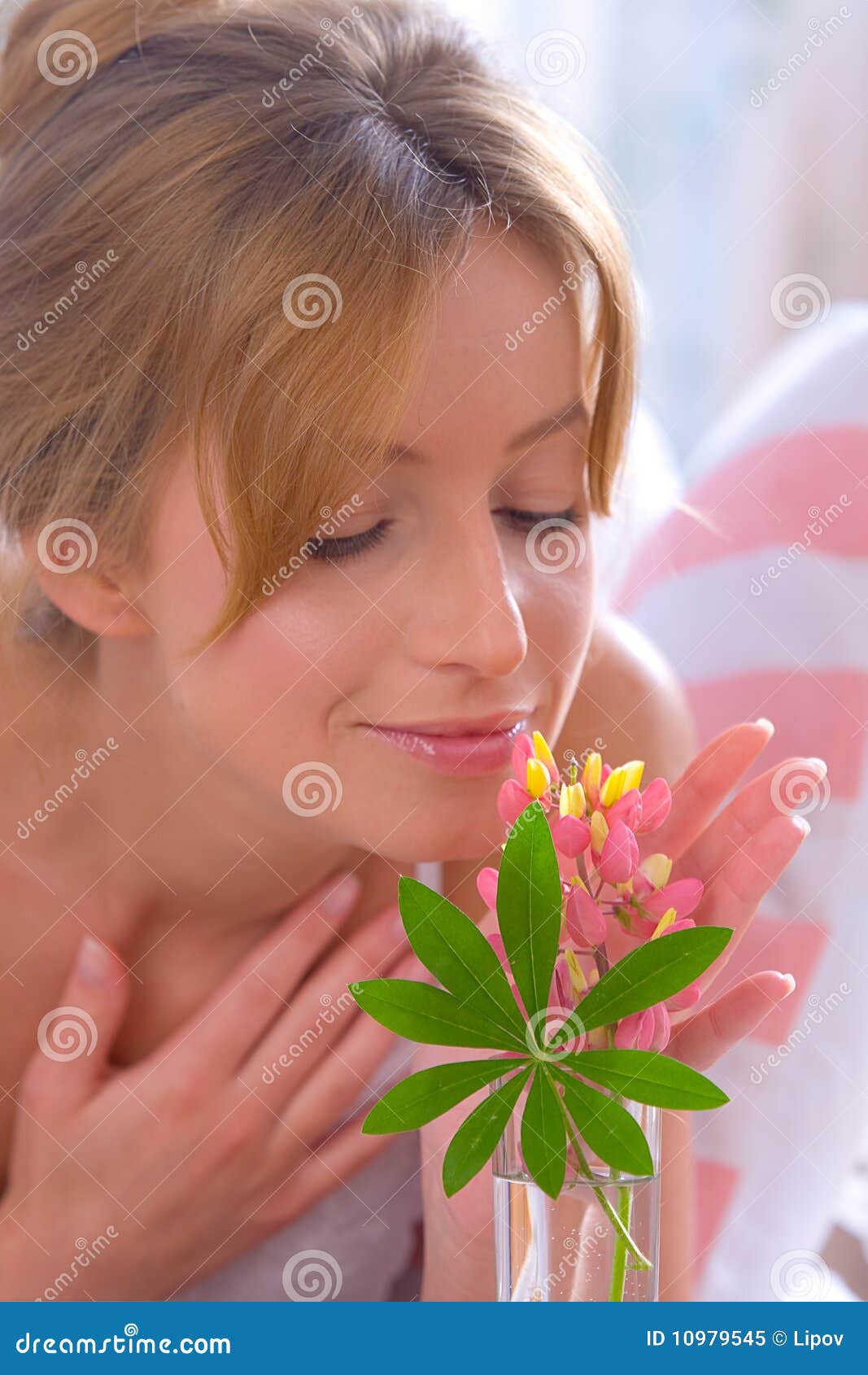 Smelling flowers stock image. Image of flowers, adult 10979545