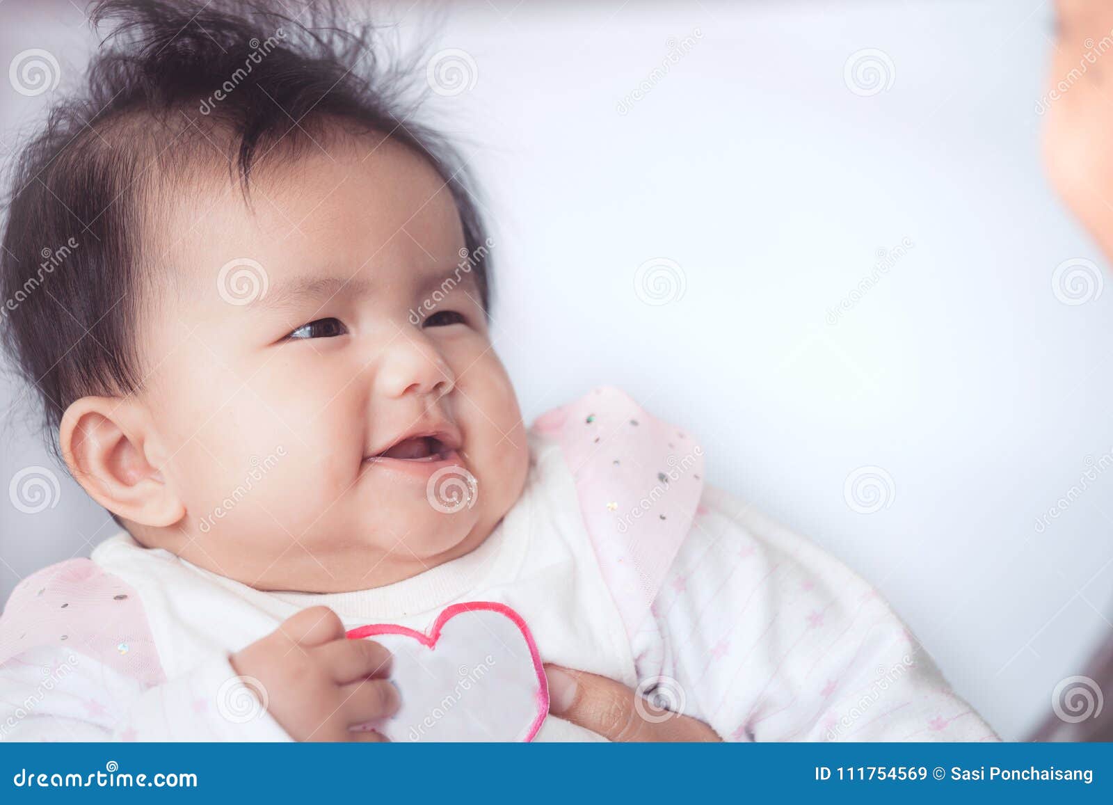 Smile Cute Asian Baby Girl is Playing and Looking at Her Parent ...