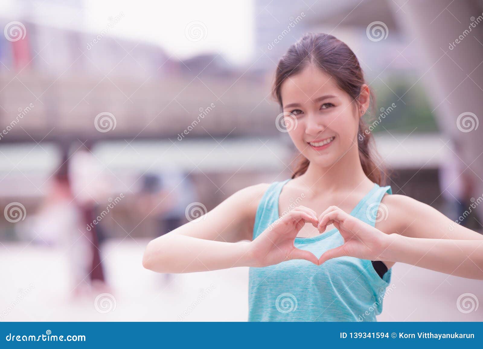 Smile Cute Asian Girl Teen Love Heart Hand Sign Stock