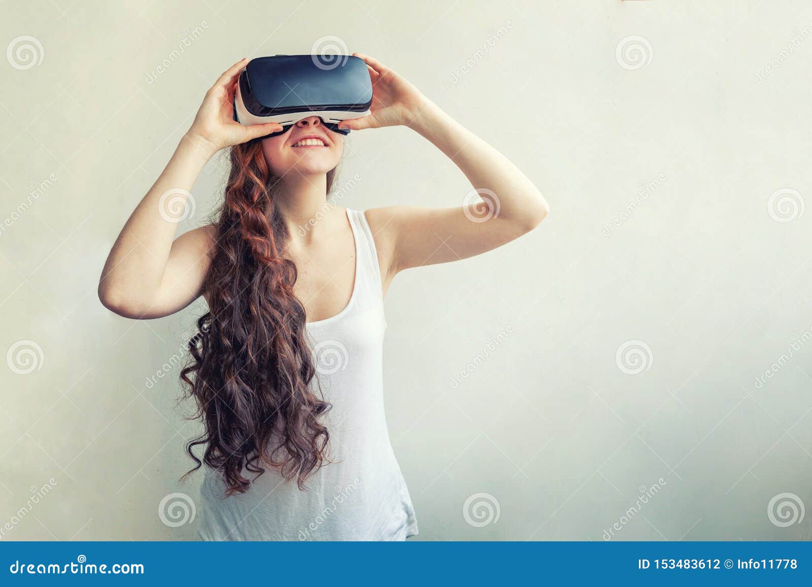 Young Attractive Woman Wearing VR Headset Glasses Of 