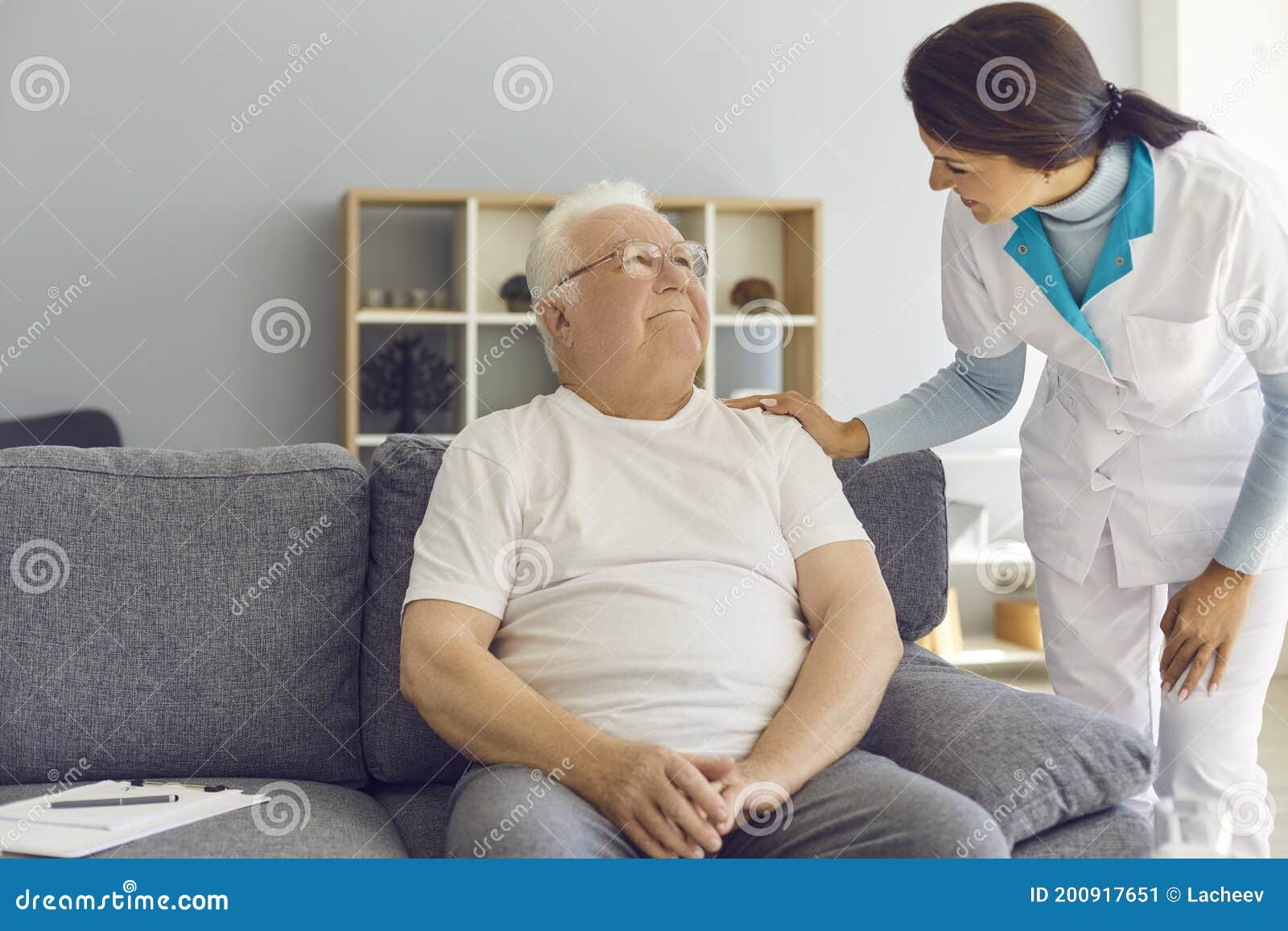 friendly doctor or helpful nurse comes to see senior patient at home or in assisted living facility