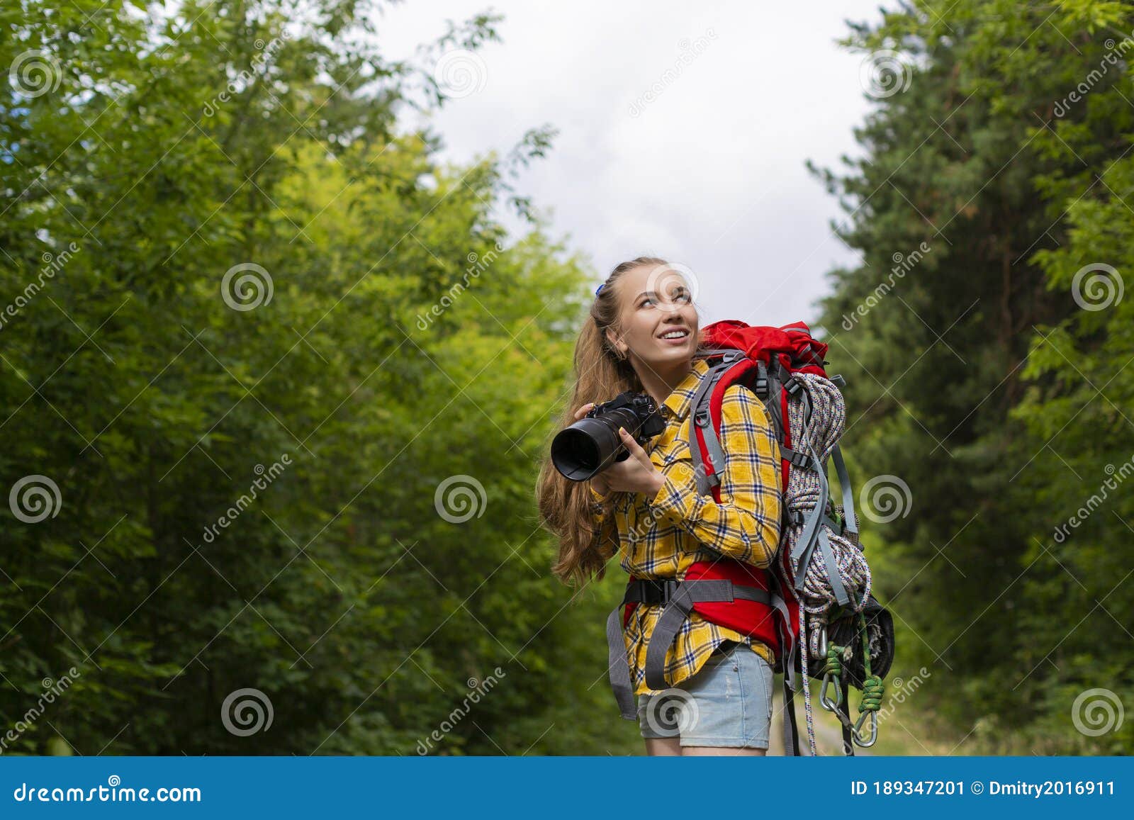 Smiley Female Hiker Woman Looking by Side and Holding Photocam. Stock ...
