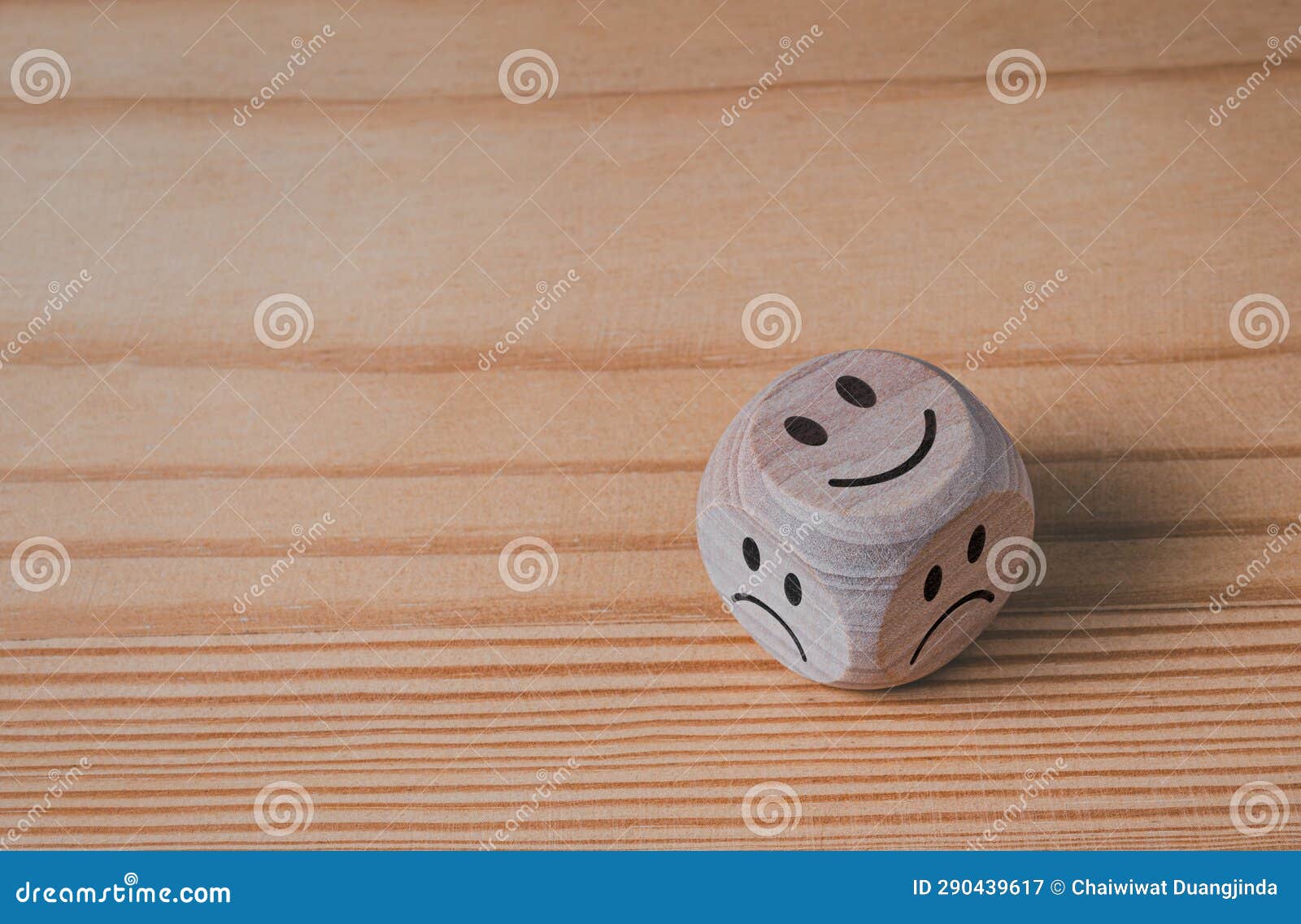 Smiley and Sad Symbols on Wooden Blocks on Wooden Background Stock