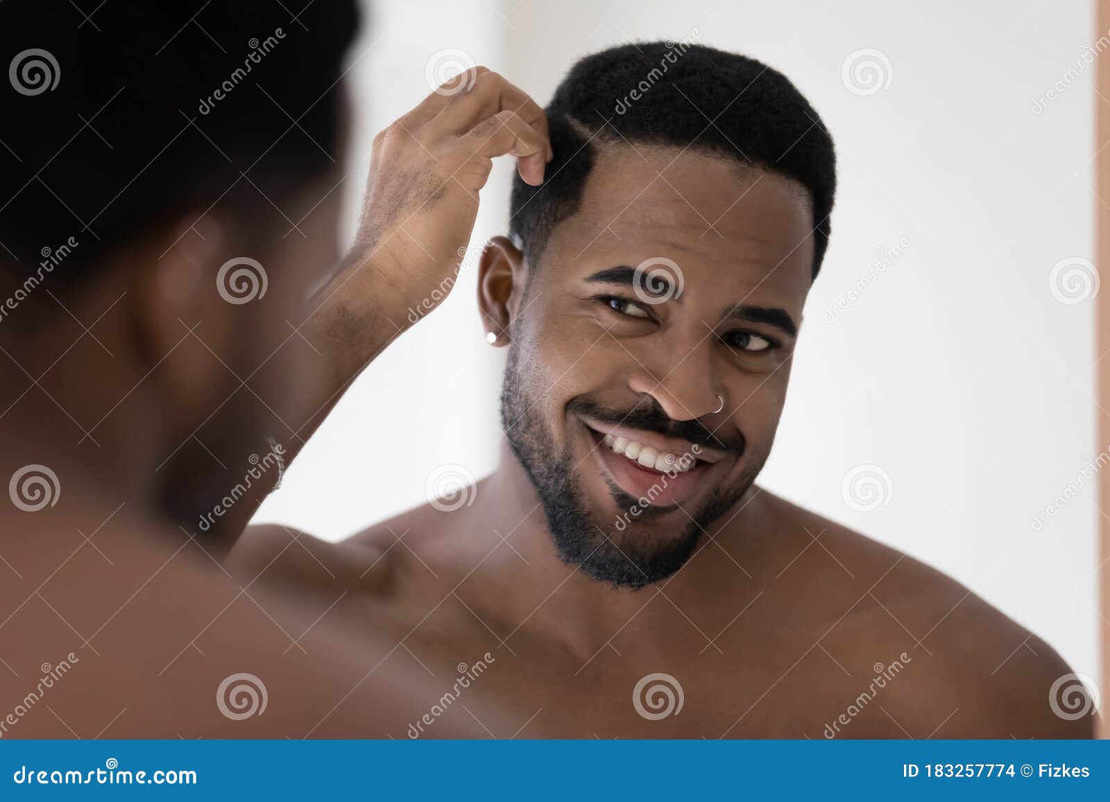 Smiling African American Man Look in Mirror in Bathroom Stock Photo - Image of bath, customer: 183257774 Smiling African American Man Look in Mirror in Bathroom Stock Photo - Image of bath, customer: 183257774