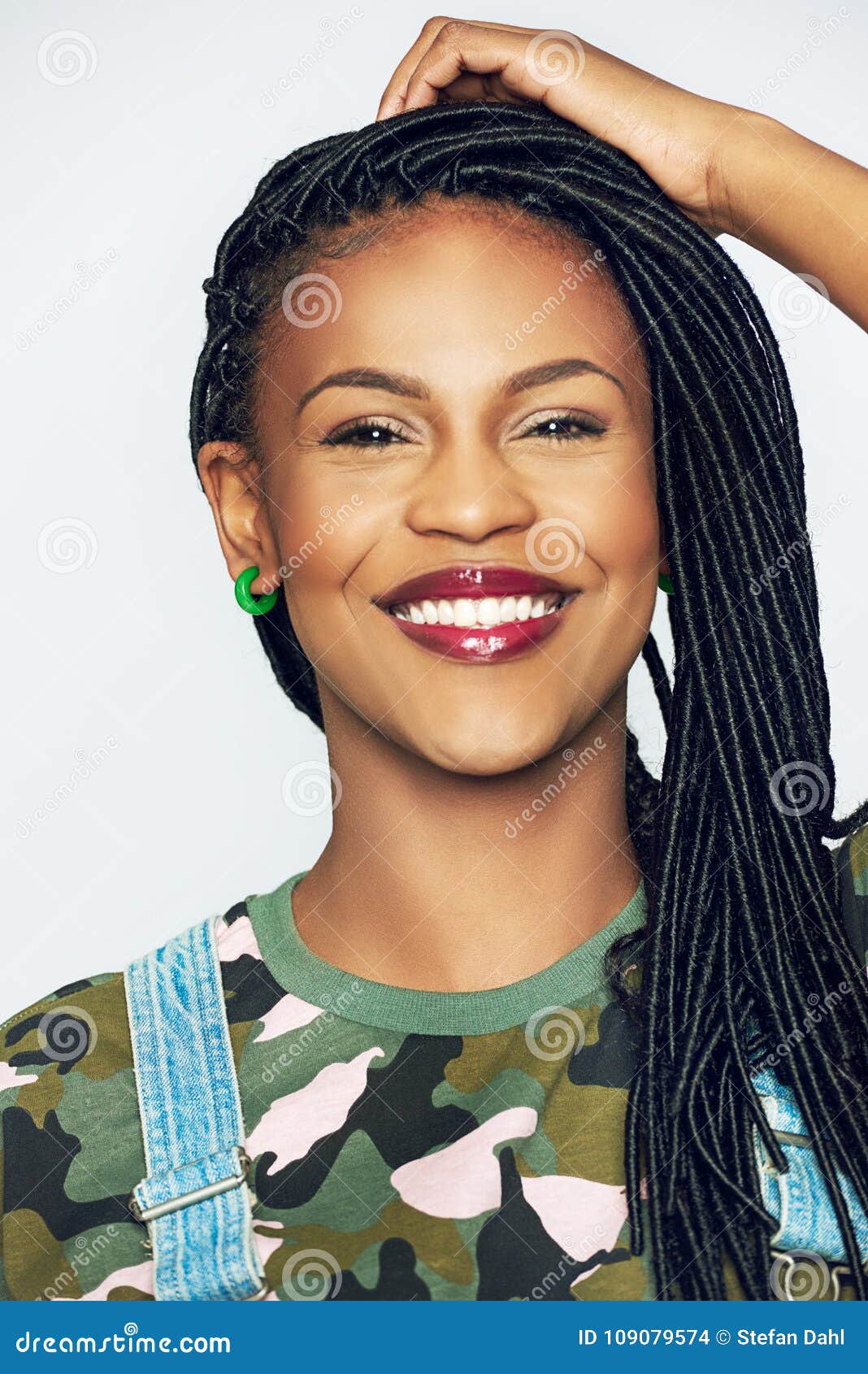 Cheerful Young Black Woman In Military Clothes Holding Head