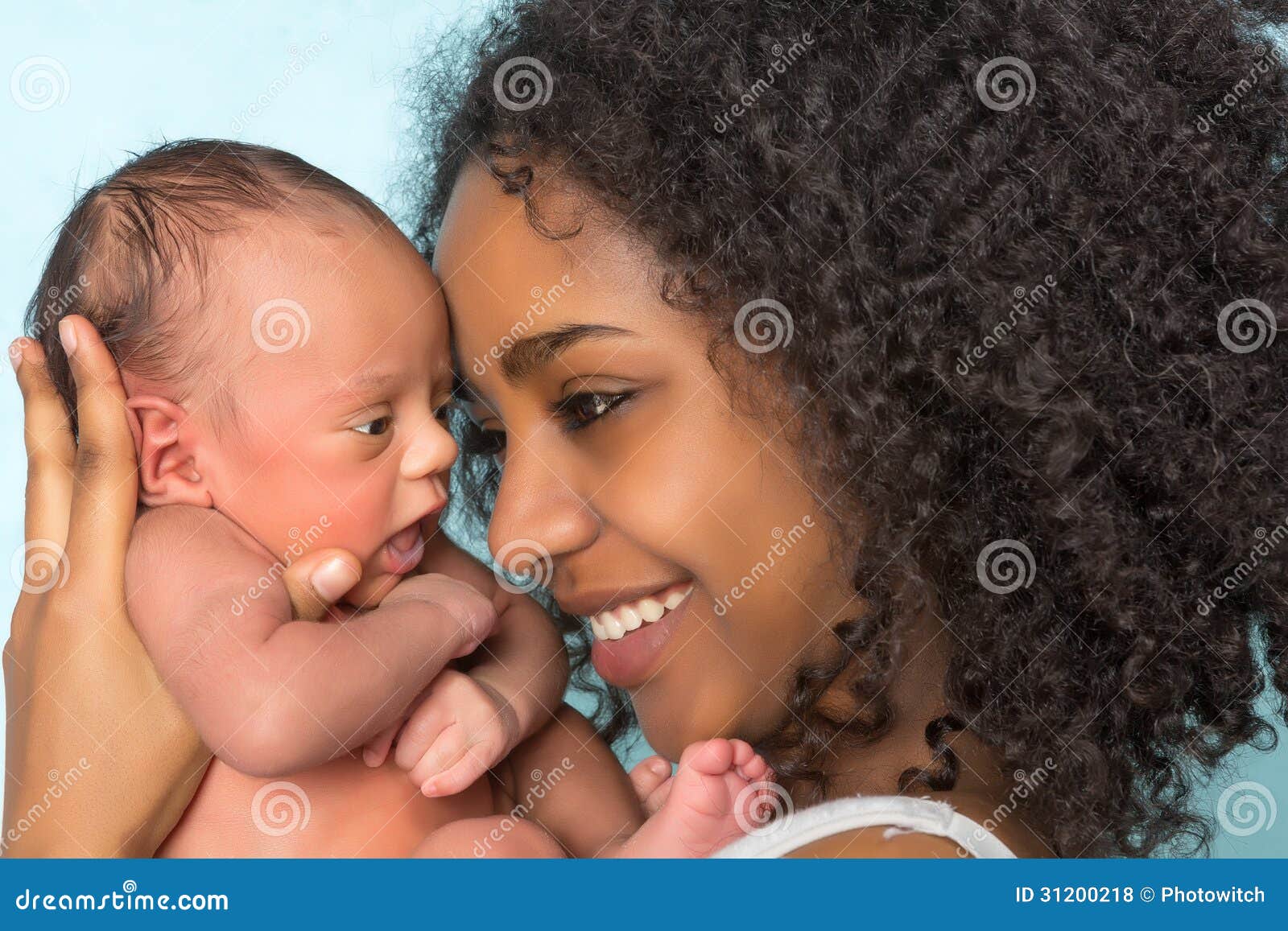 smiling african mother and baby