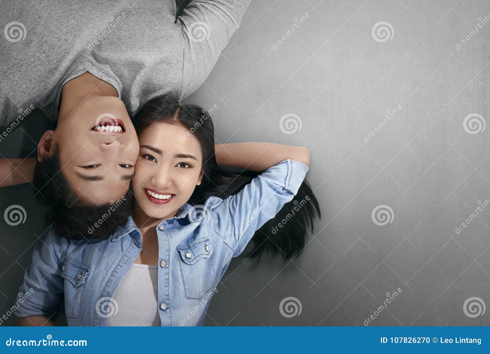 Smiling Asian Couple in Love Lying Down Stock Photo Image of