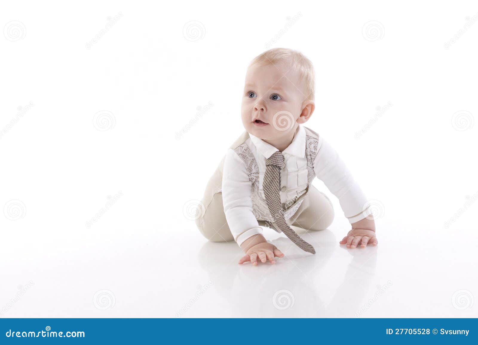 smiling baby-boy in a romper suit crawling