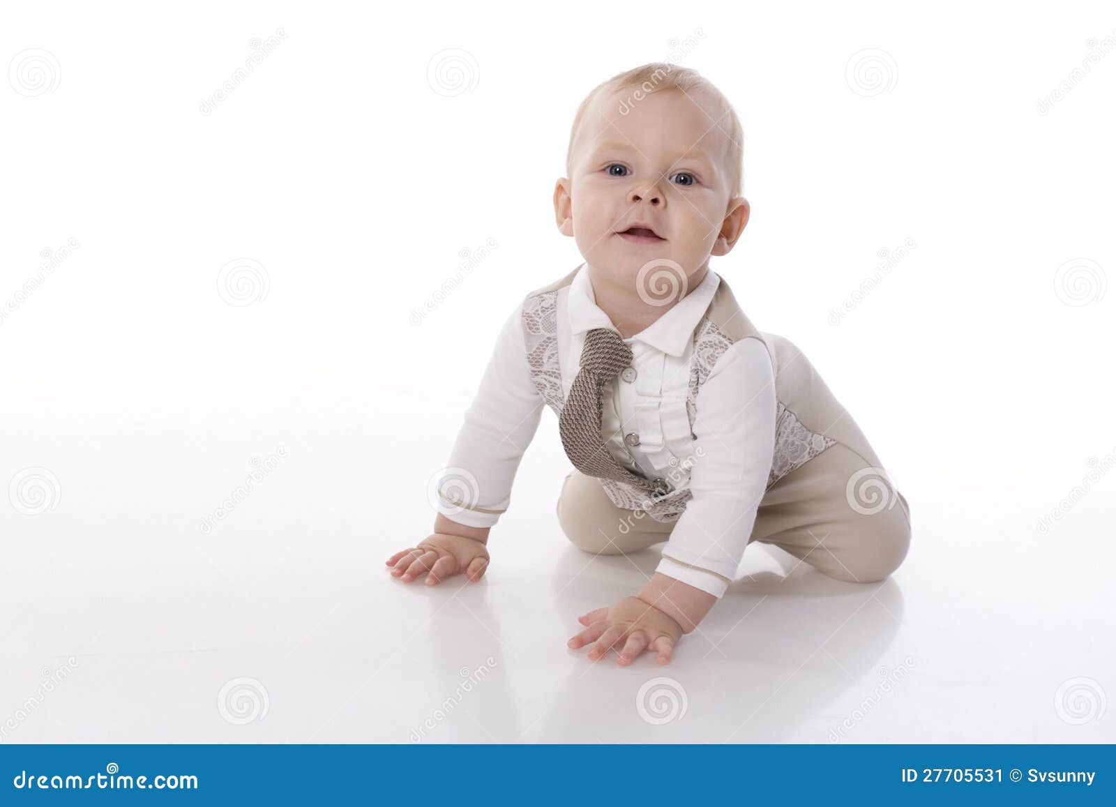 smiling baby-boy in a romper suit crawling