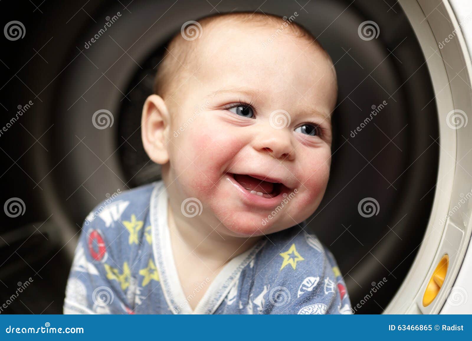 Smiling baby in the dryer stock image. Image of interior 63466865