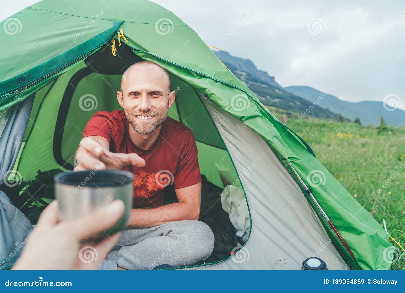 Smiling Bald Man in the Green Tent Taking the Thermos Teacup for ...