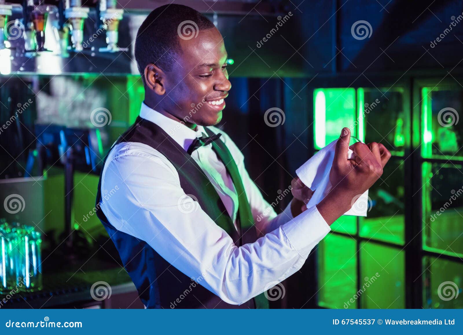 Smiling Bartender Cleaning a Glass Stock Image Image of holding