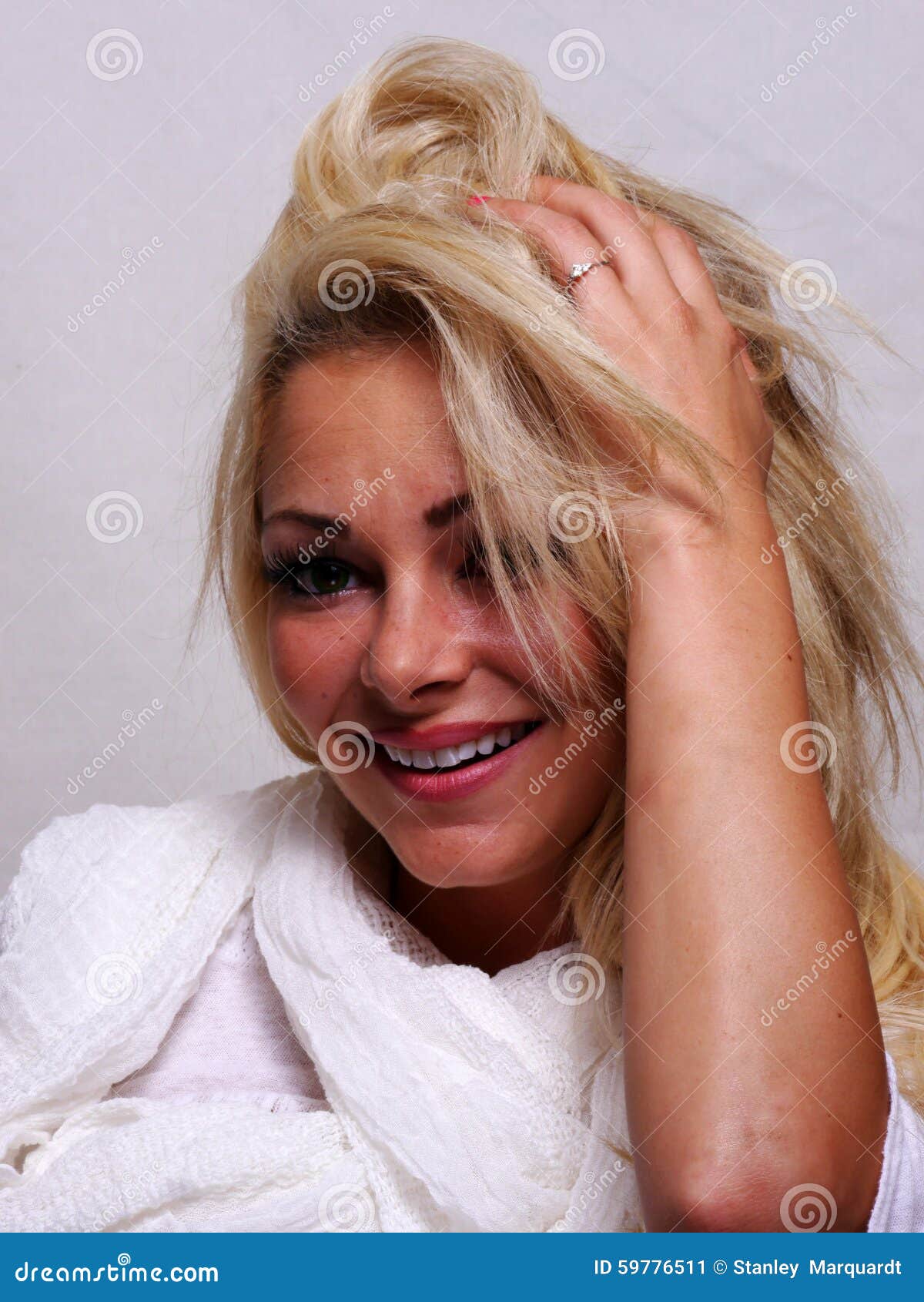 A Smiling Blond Haired Woman Is Looking Into The Camera Stock Image Image Of Pretty