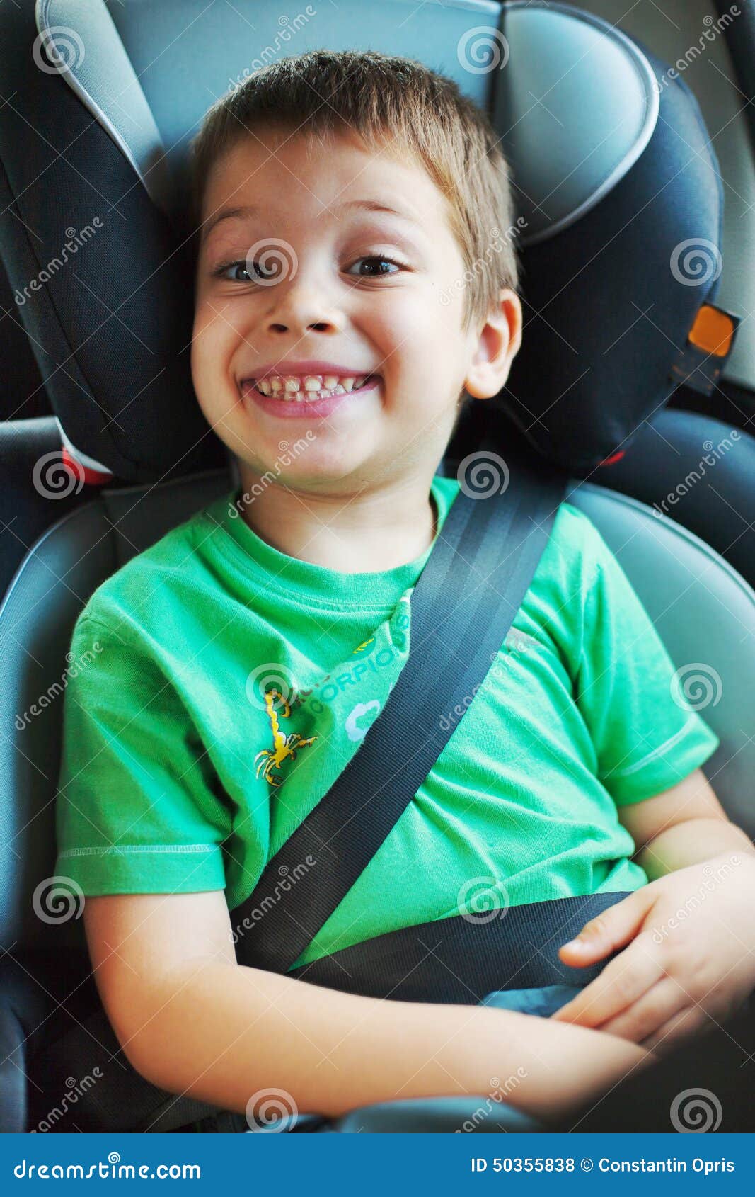 Smiling boy in car seat stock photo. Image of safely 50355838