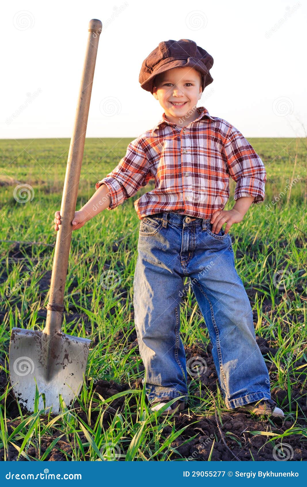 Smiling boy with shovel stock image. Image of gardening 29055277