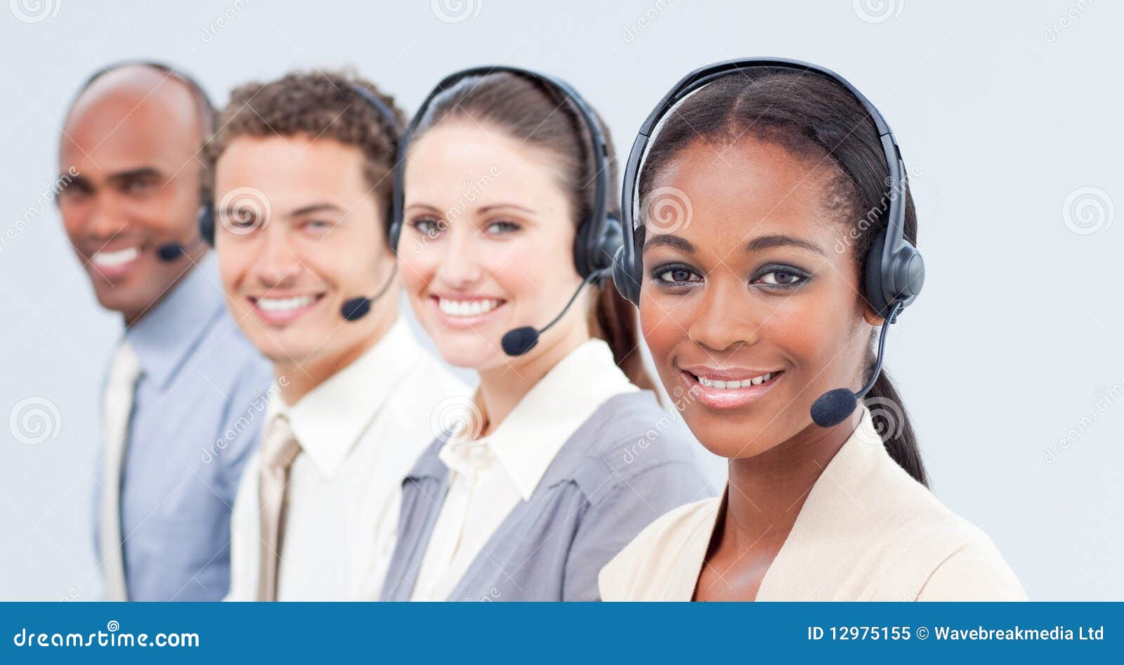 Smiling business team with headset on